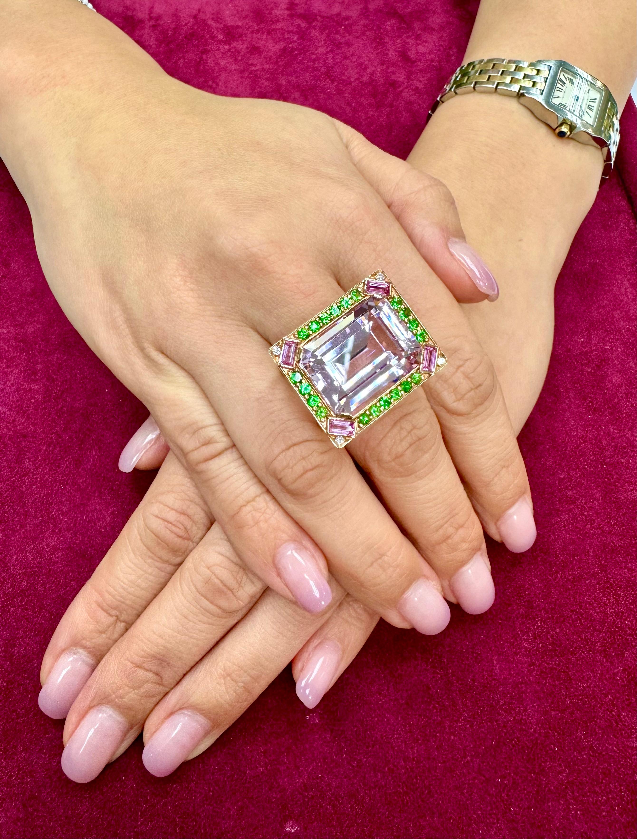 Please check out the HD video! Extra extra large ultra Morden design. If you want a statement piece, this is it!  The XXL kunzite has a very nice pink! This cocktail ring will get you tons of compliments. Oversized at 26.74cts. The ring is set  with