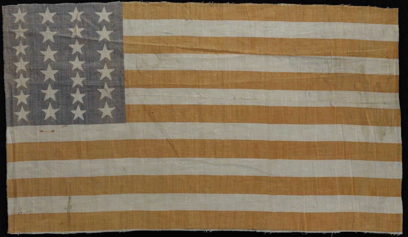 This printed 26-Star American flag celebrates Michigan statehood. The 26th star represents Michigan, which was admitted as the 26th state on July 4, 1837. 26-star flags were the official star count from 1837 until Florida gained statehood in 1845.
