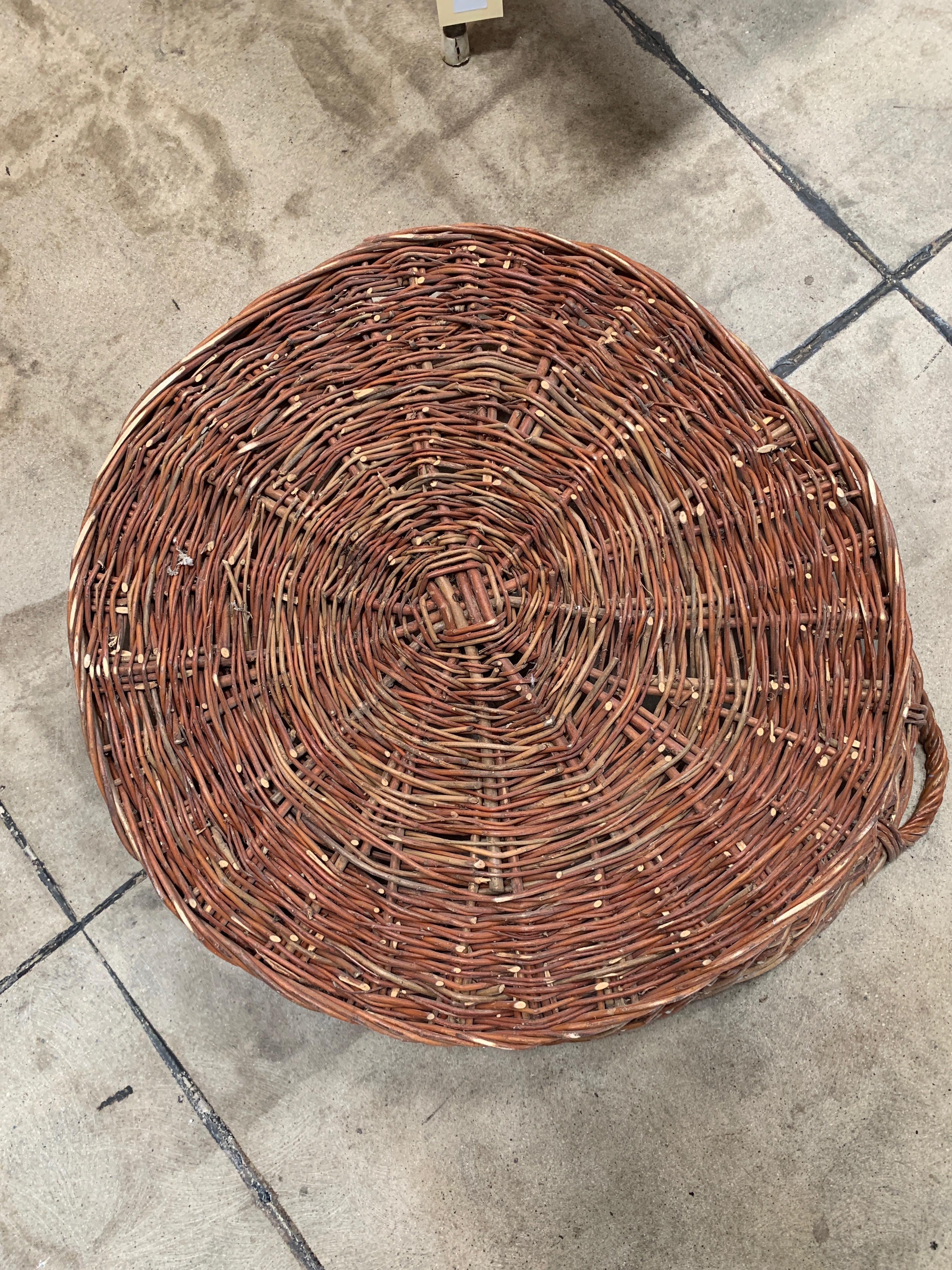 Versatile flat-woven basket from Europe. Makes a wonderful decoration but could also be used to collect from your garden or as a storage piece! Measures: 26