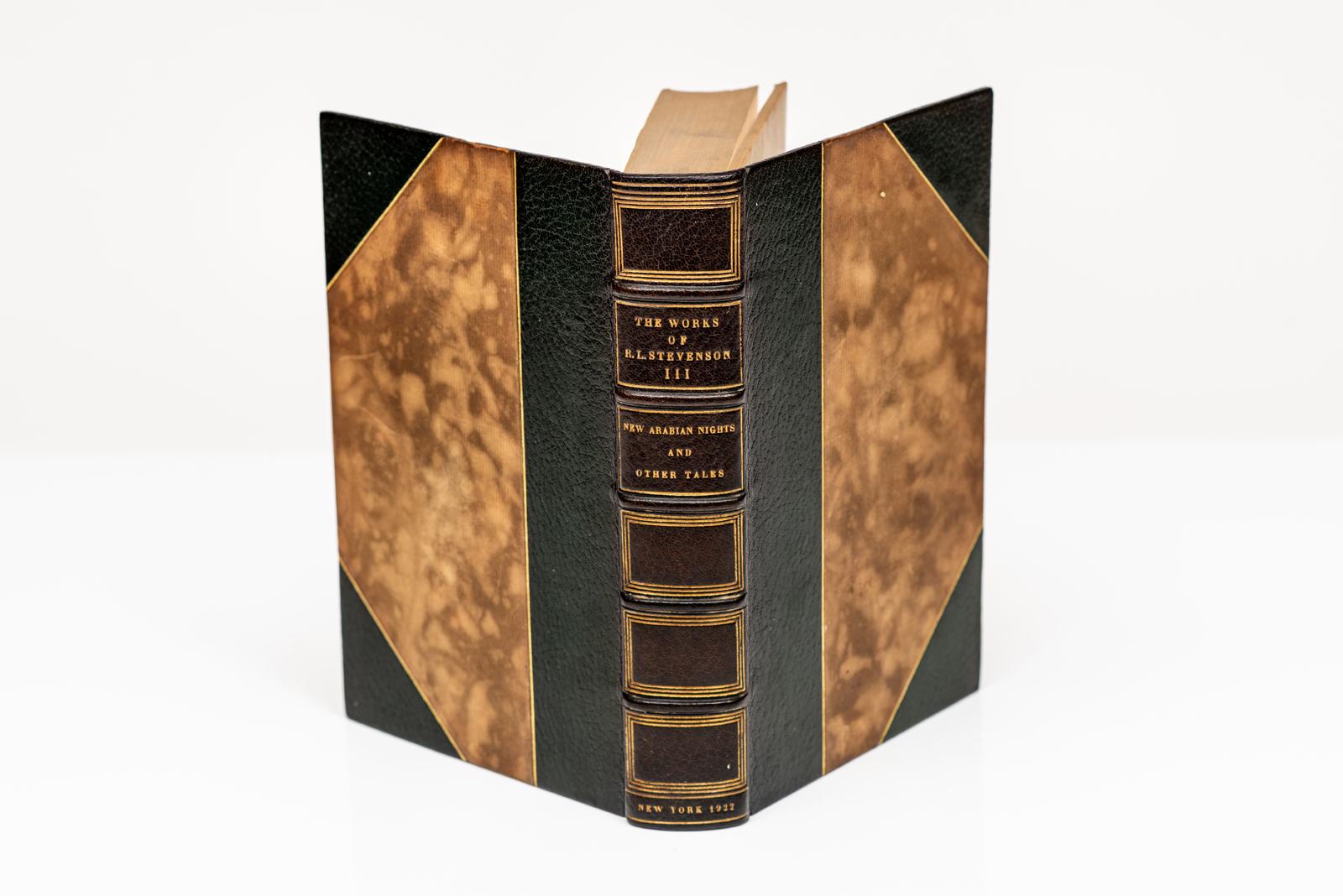 26 Volumes. Robert Louis Stevenson. Complete Works. Vailima Edition. Bound in 3/4 black morocco with marbled boards. Covers and raised band spine are gilt-tooled. Top edges gilt. Marbled endpapers. Limited to 1,030 copies of which this is 7.