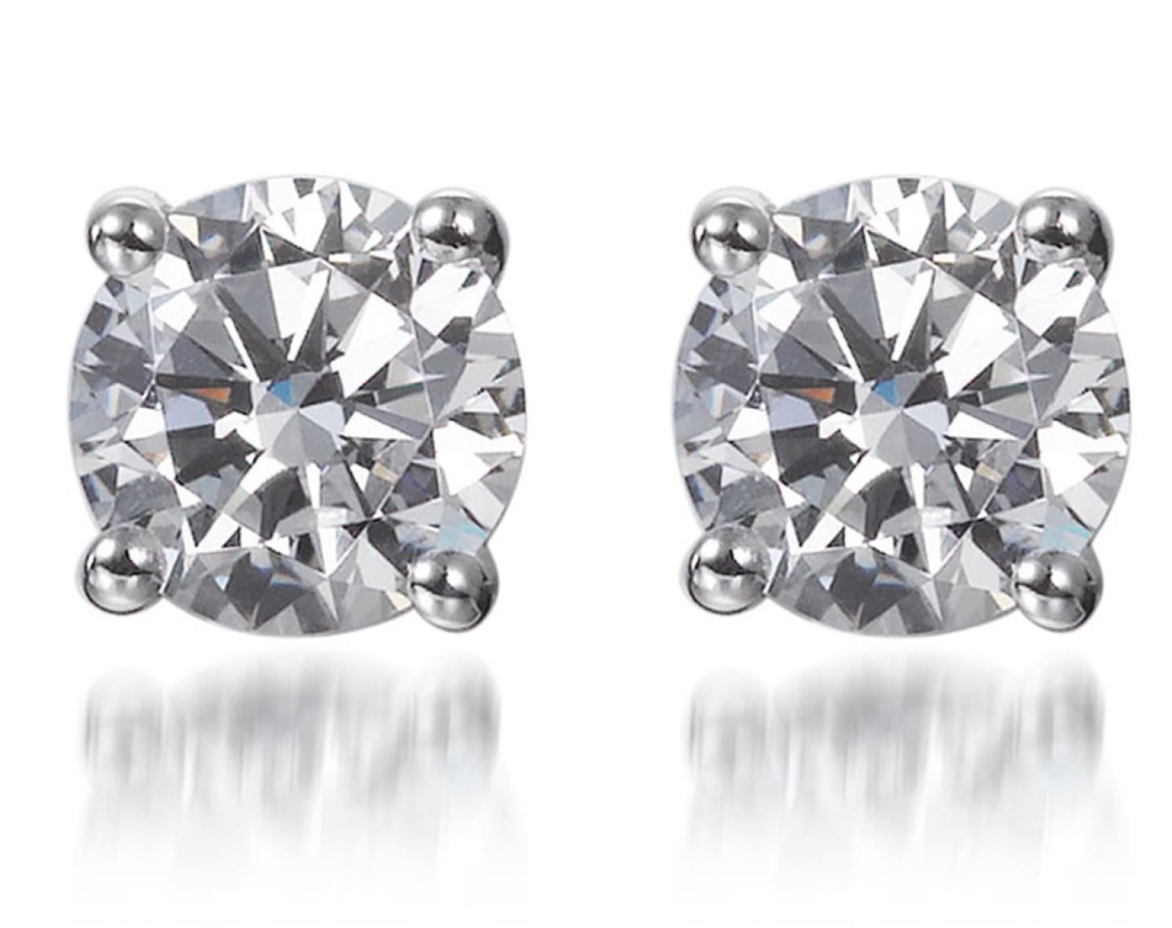 These classy 2.60ct cubic zirconia classic solitaire stud earrings, crafted in rhodium plated silver each feature a single 1.30 carat round brilliant cut cubic zirconia, elegantly set in a simple four-claw setting.

Designed to be worn from desk to