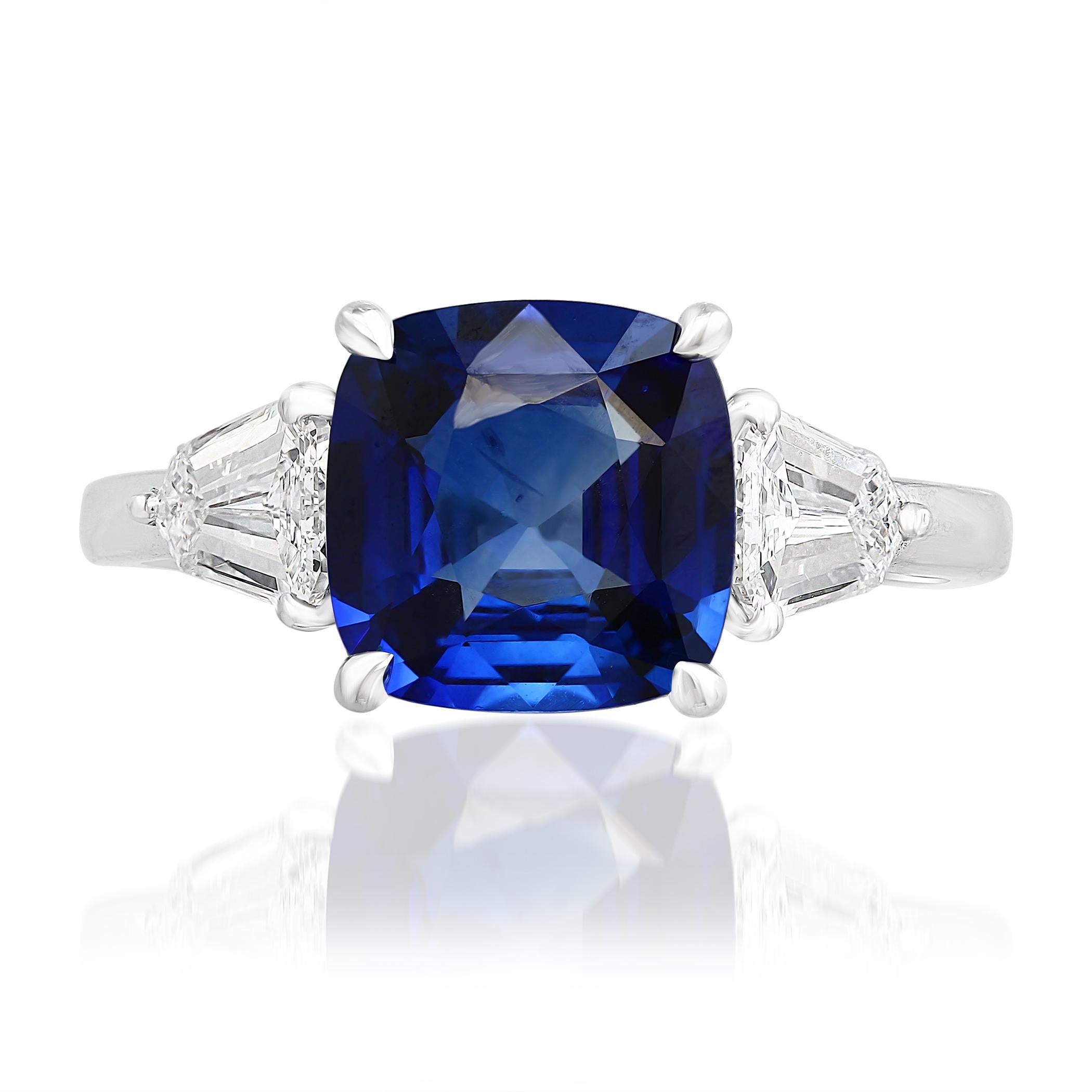 Features a gorgeous 2.60 carat cushion cut blue sapphire. Flanked by a bullet cut diamond side stone and each side weighing 0.71 carats total. Set in platinum.

Style available in different price ranges. Prices are based on your selection. Please