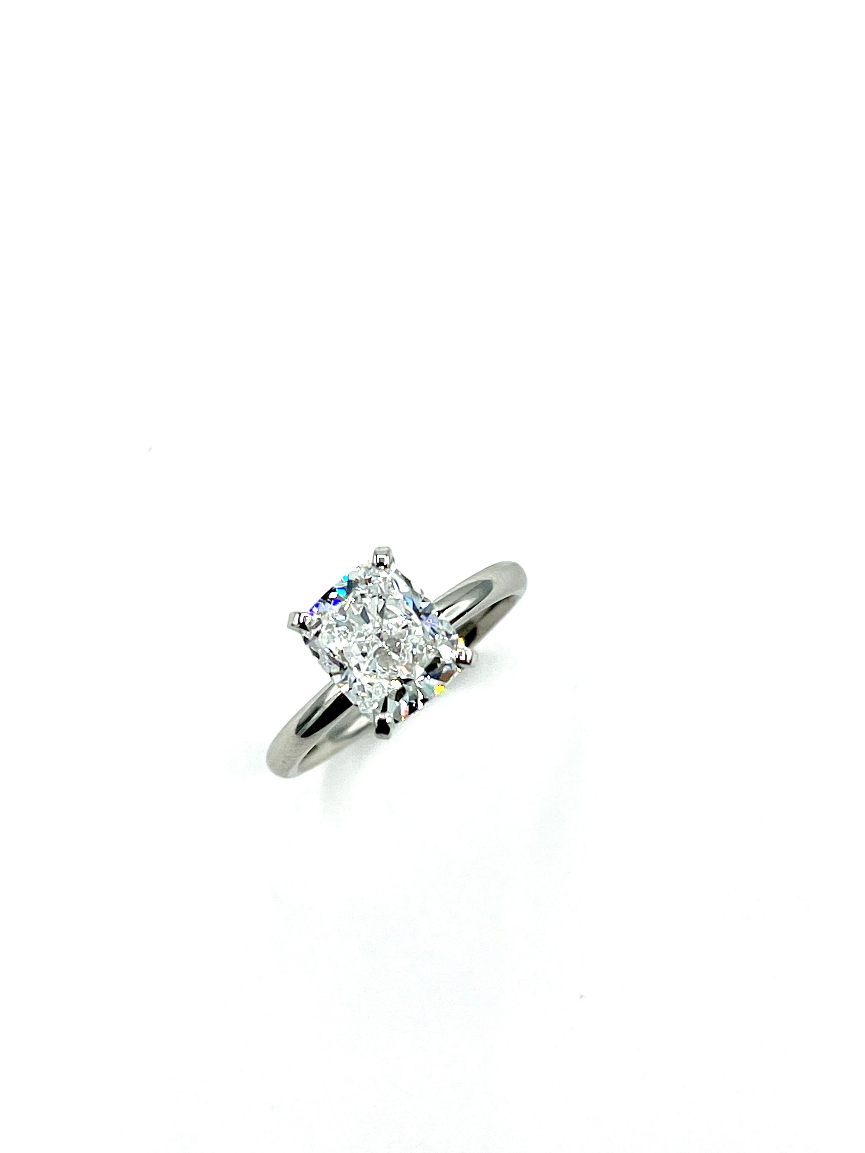 A gorgeous cushion cut Diamond solitaire ring.  The Diamond is set in a simple four prong platinum mounting.  The Diamond weighs 2.60 carats, and is graded as D color, VS2 clarity, by GIA report number 6402833165.  This cushion displays wonderful