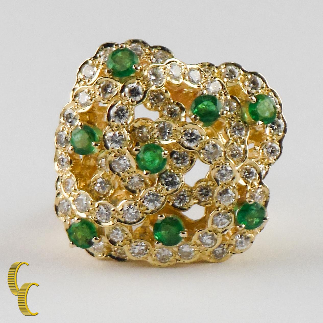 Gorgeous, Unique Diamond and Emerald Cocktail Ring
Features Bead-Set Diamond Interlocking Rings w/ Interspersed Prong-Set Emeralds set atop an elevated wire gallery
18k Yellow Gold Setting
Approximate Diameter of Each Ring = 15 mm
Approximate