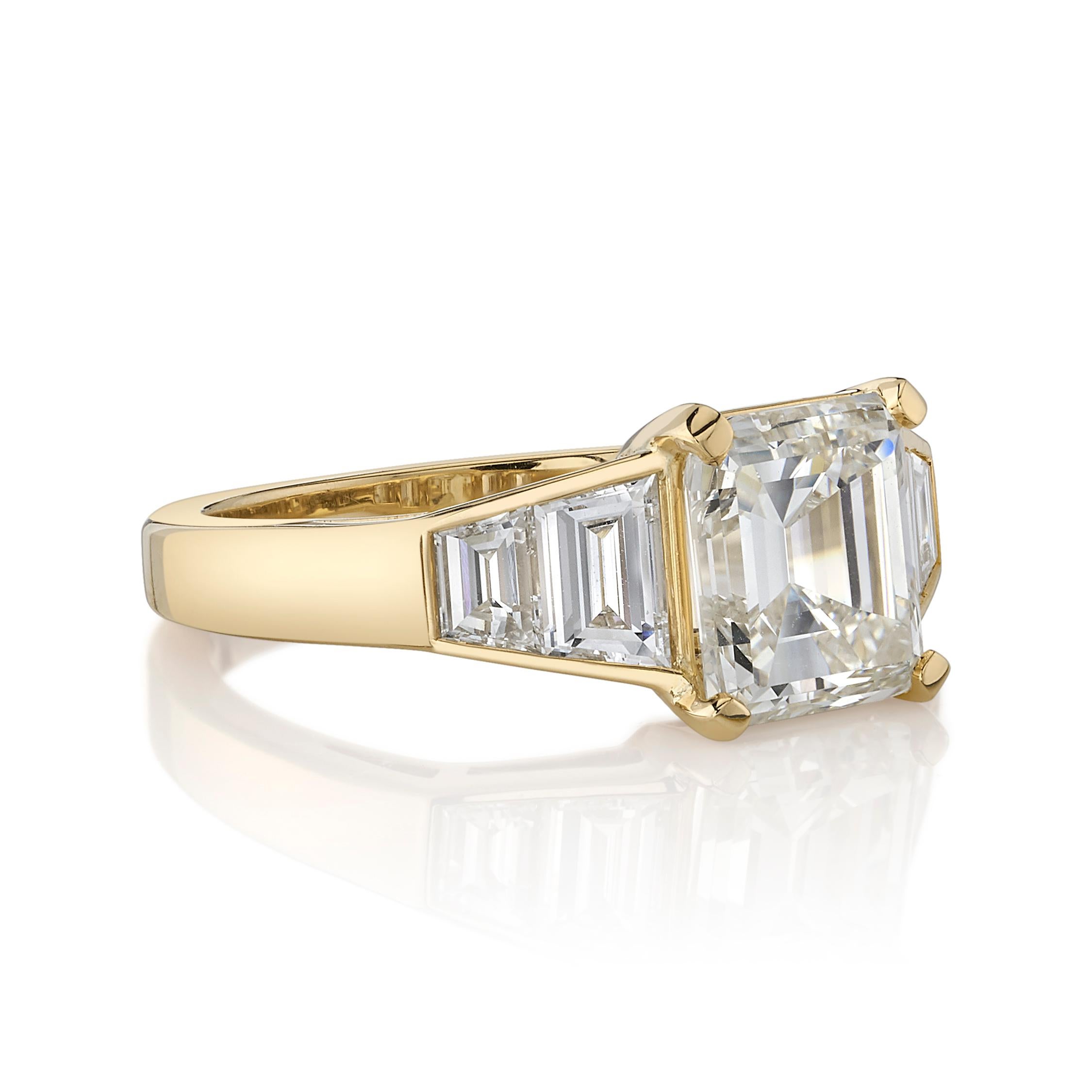 2.60ct L/SI1 GIA certified vintage Asscher cut diamond with 0.86ctw Trapezoid cut accent diamonds set in a handcrafted 18K yellow gold mounting.

Ring is currently a size 6 and can be sized to fit.

Our jewelry is made locally in Los Angeles and