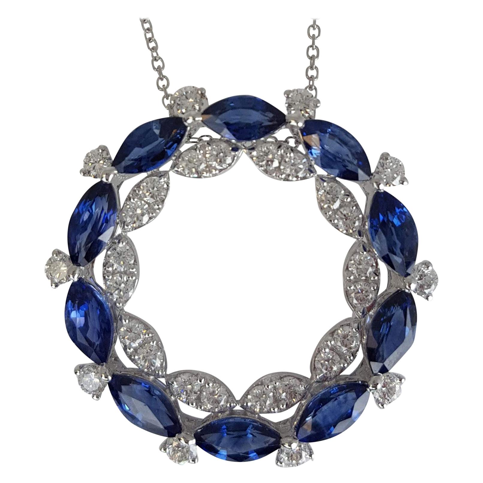 This sapphire pendant defines opulence with its breathtaking double halo design. This captivating piece is a true work of art, featuring a symphony of gemstones that will leave you in awe.

On the outer halo, you'll find a striking arrangement of 10