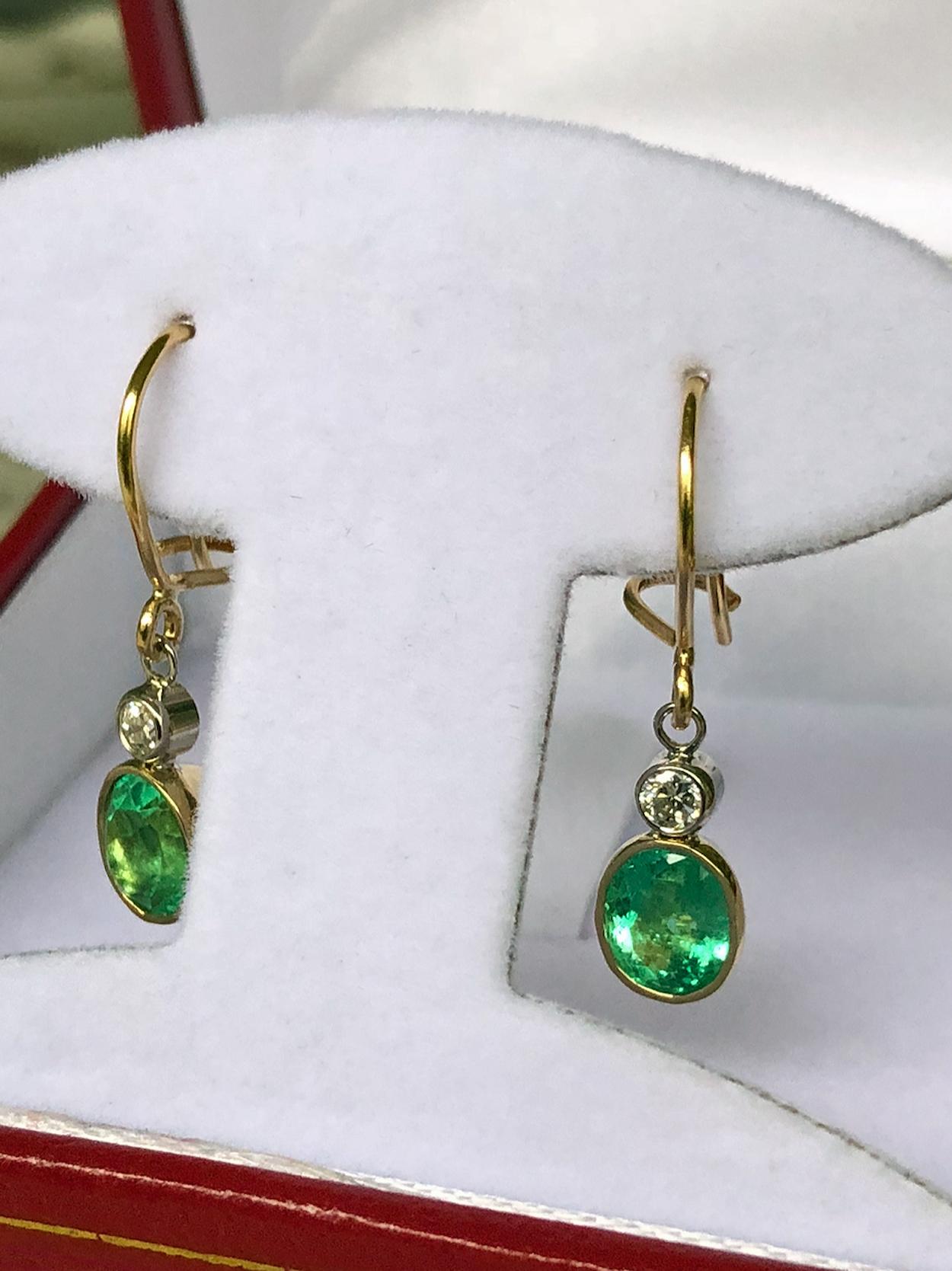 2.60 Carat Natural Colombian Emerald Diamond Dangle Drop Earrings 18K Gold
Primary Stones: 100% Natural Colombian emeralds
Shape or Cut Emerald : Oval Cut 
Average Color/Clarity : Beautiful Medium 100% NATURAL Green Color/ Clarity VS 
Total Weight