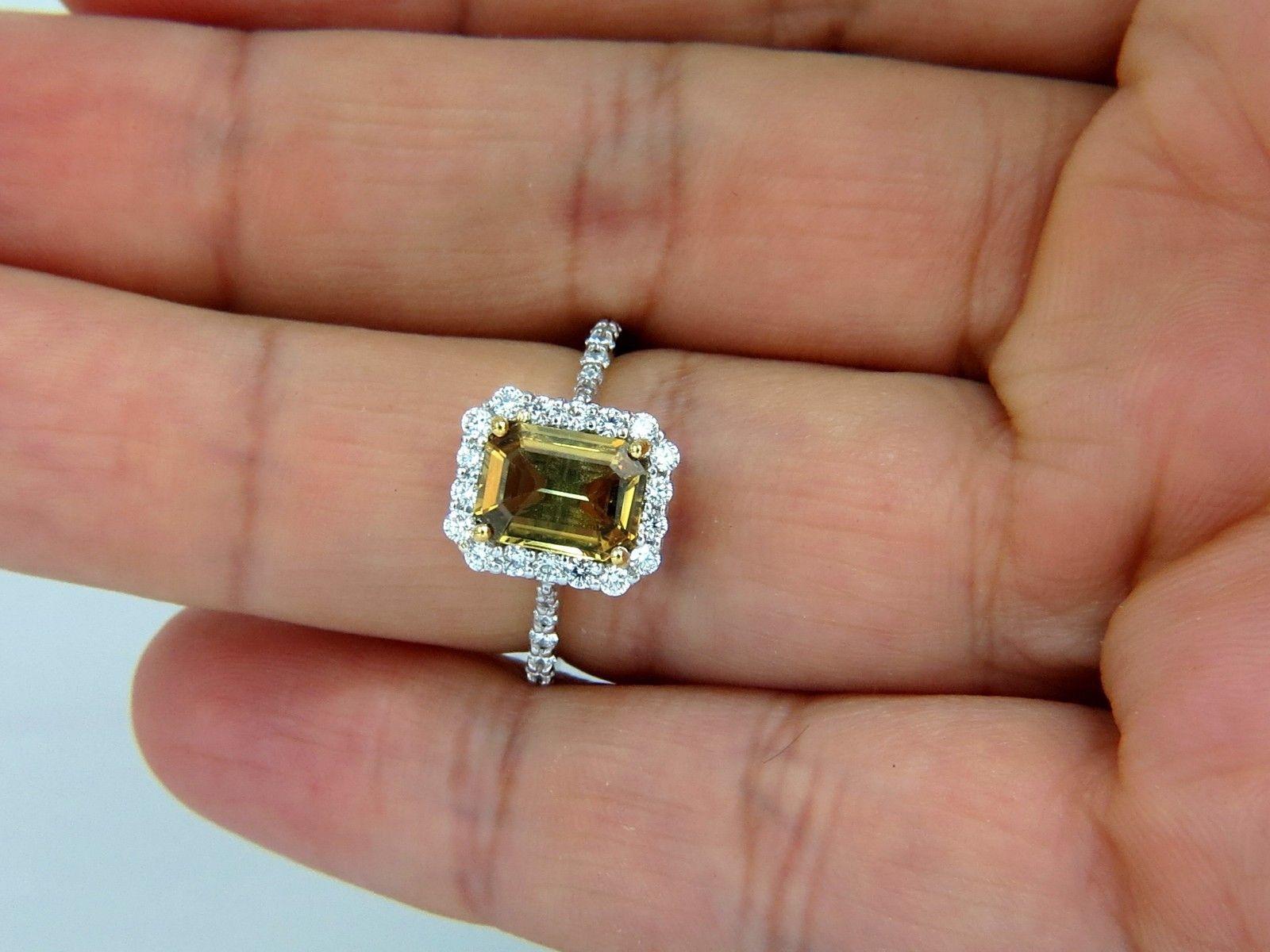 1.80ct. Natural Golden Yellow Brown sapphire ring.

Vivid color

Clean clarity.

Emerald, full cut

8.6 X 6.5mm

Transparent, Vibrant  Golden color



.80ct. Side natural round diamonds: 

G-color, Vs-2 clarity.

14kt. white gold

3.7 grams.

Deck
