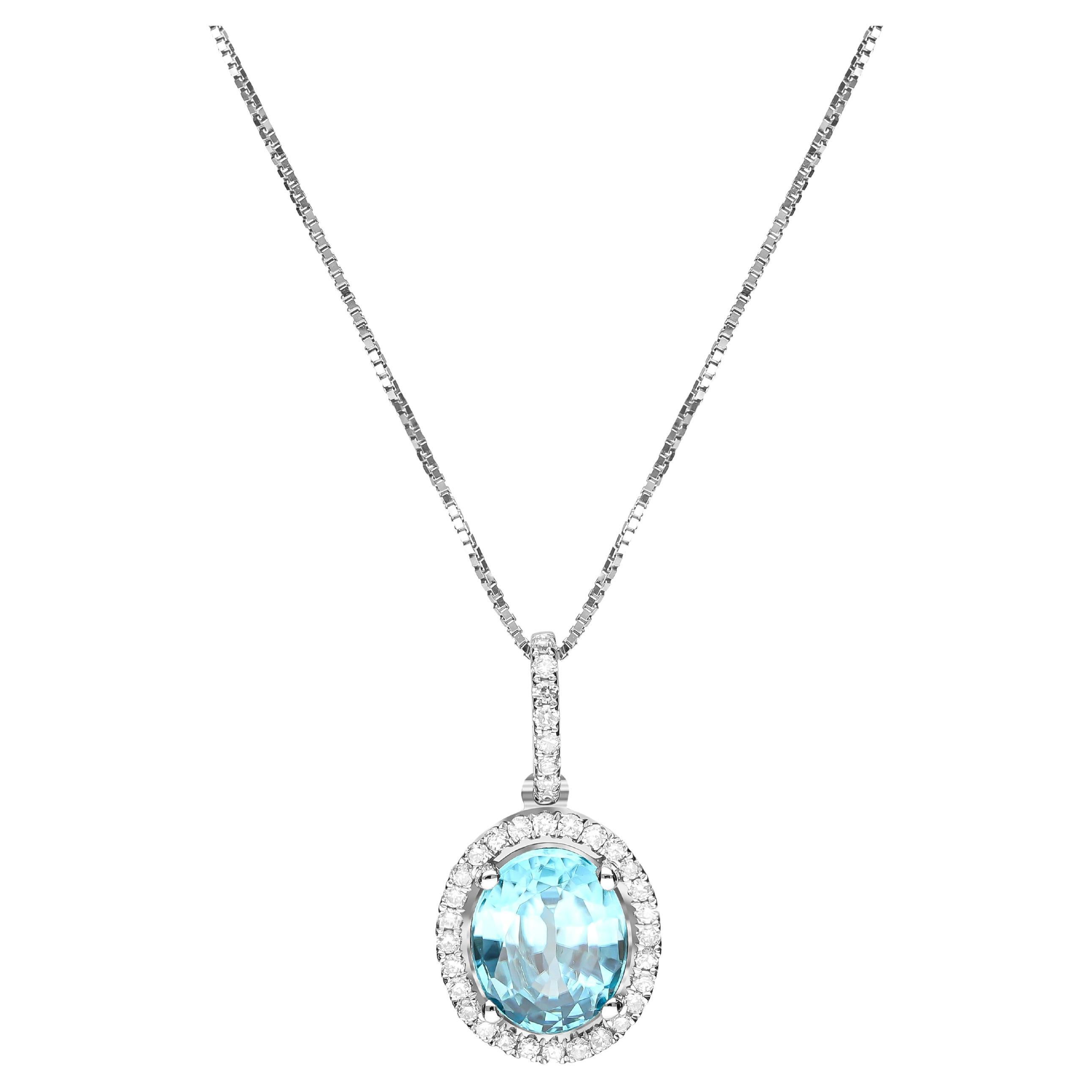 Pendentif en or blanc 14 carats avec diamants et zircon bleu taille ovale de 2,60 carats