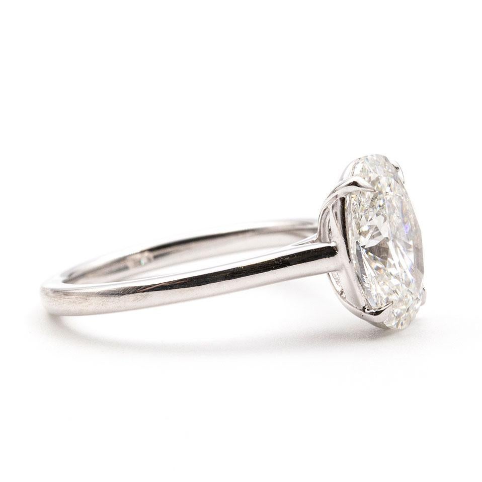 Forged in 18 carat white gold is this alluring 2.60ct oval brilliant cut diamond. This exceptional diamond ring is beautifully crafted in a minimalistic design that lets this diamond take centre stage. The diamond shines brightly and scintillates