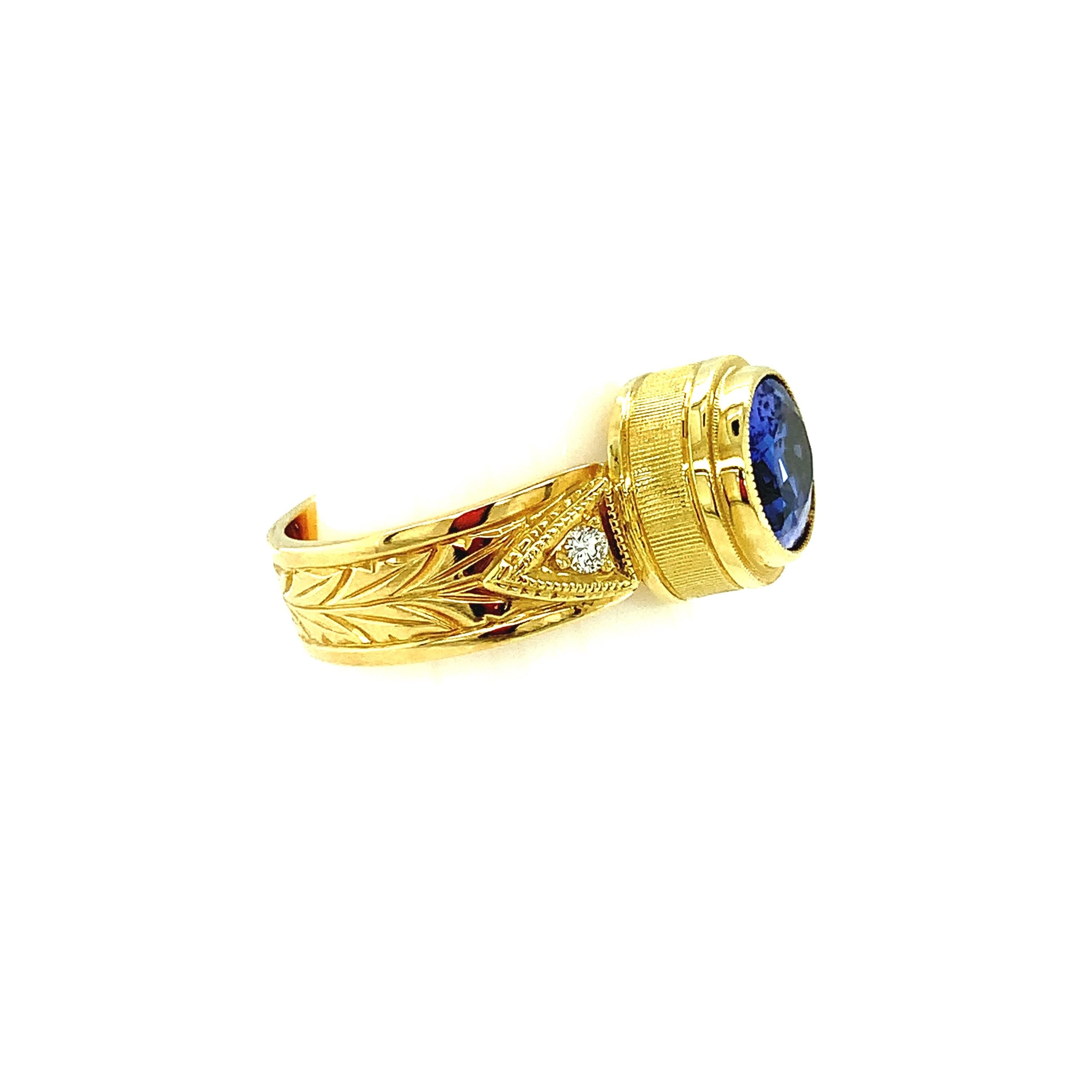 Oval Cut 2.60 Carat Oval Tanzanite, Diamond Yellow Gold Engraved Bezel Band Ring