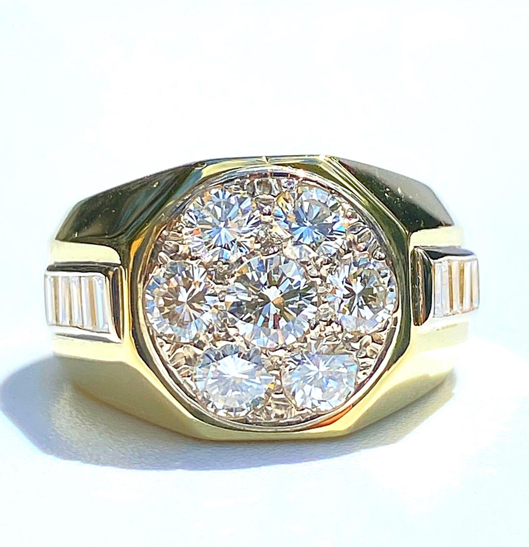 Centered by seven Round-Brilliant Cut Diamonds totaling ~2.60 Carats, accented by an additional 10 Baguette-Cut Diamonds, and set in 18K Yellow Gold, this 18K Yellow Gold and White Diamond Men's cluster ring is a collection staple: a classic men's