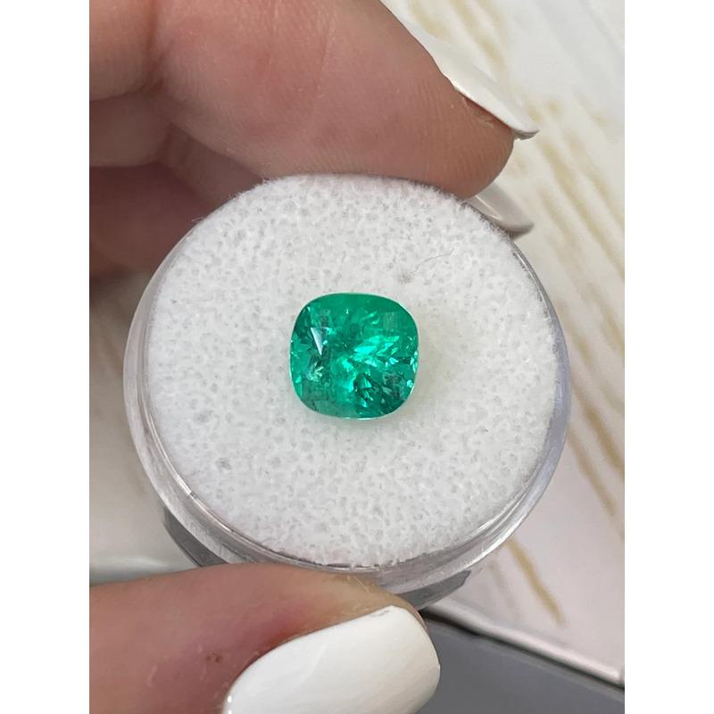 Stone: Emerald
Weight: 2.60-carats
Shape: Cushion Cut
Clarity: Transparent
Luster: Excellent
Color: Vivid Bluish Green
Measurements: 8.29mm x 8.08mm x 6.79mm
Geographic Origin: Colombia
Treatment: Natural, Oiling

Comments: Due to their growth