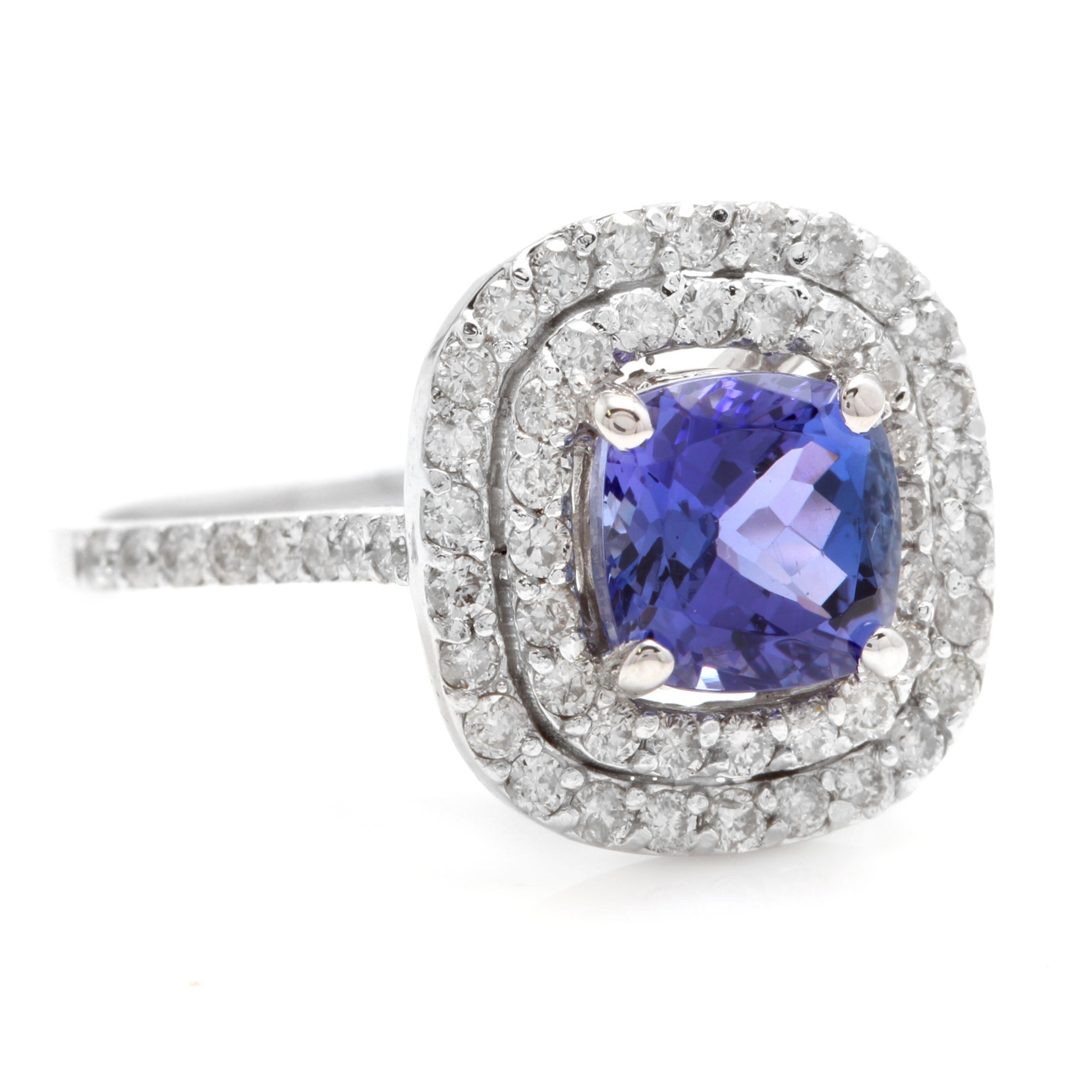 2.60 Carats Natural Very Nice Looking Tanzanite and Diamond 14K Solid White Gold Ring

Total Natural Cushion Cut Tanzanite Weight is: 1.70 Carats

Tanzanite Measures: Approx. 9.00 x 7.00mm

Natural Round Diamonds Weight: 0.90 Carats (color G-H /