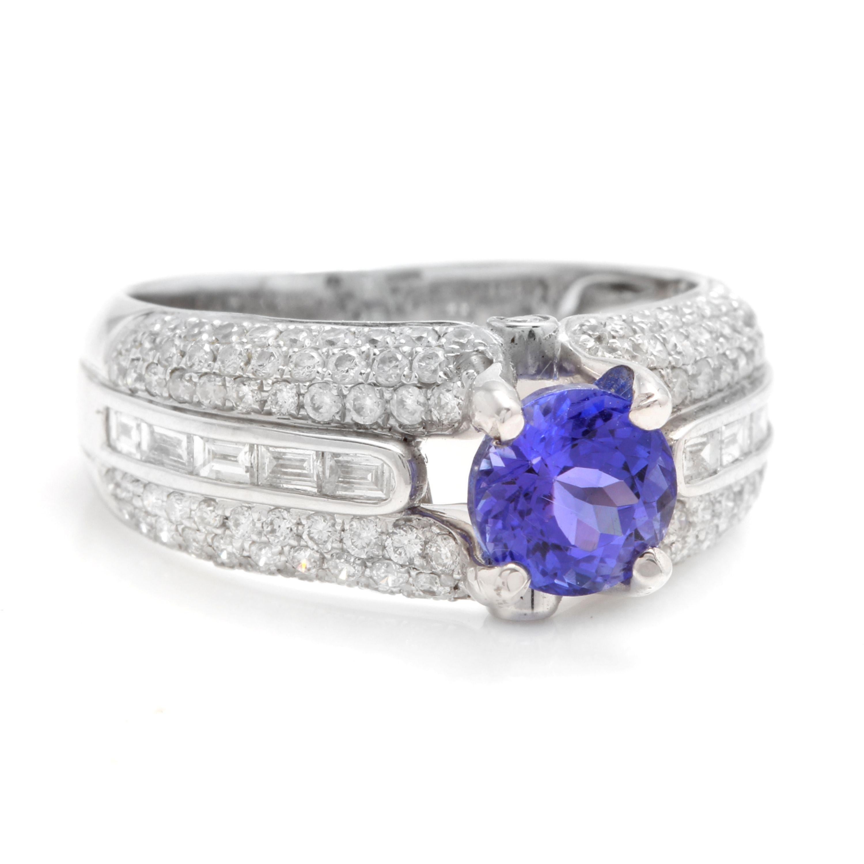 2.60 Carats Natural Very Nice Looking Tanzanite and Diamond 18K Solid White Gold Ring

Total Natural Round Cut Tanzanite Weight is: Approx. 1.60 Carats

Tanzanite Measures: Approx. 6.30mm

Tanzanite Treatment: Heating

Natural Round & Baguette
