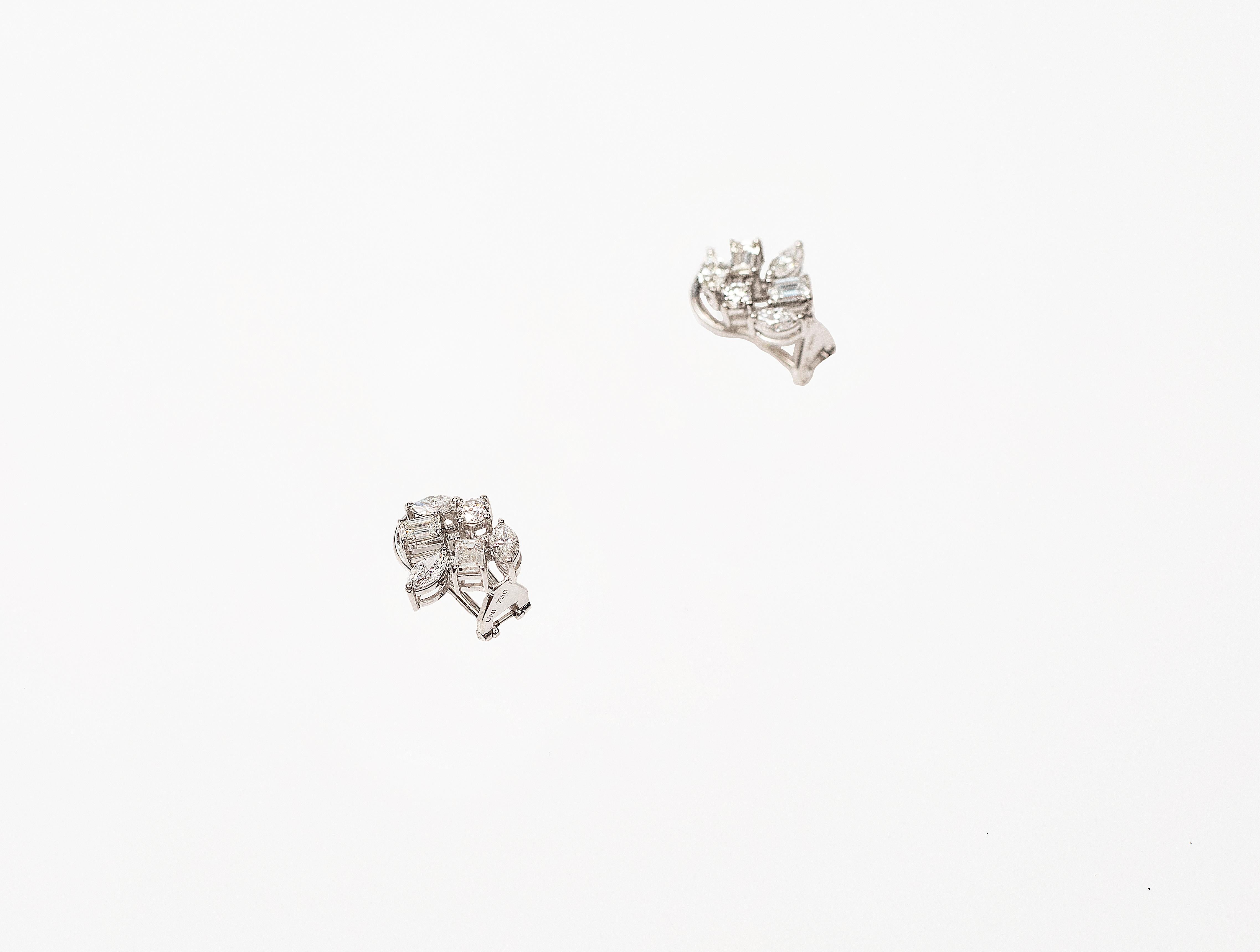 Handcrafted Studs Earrings in 18K Gold Studded with Stubbies, Marquise and Round Shape Diamond.
Gold Weight - 5.357 gms
Diamond Clarity - VS
Colour - F-G

Post and Clip System
