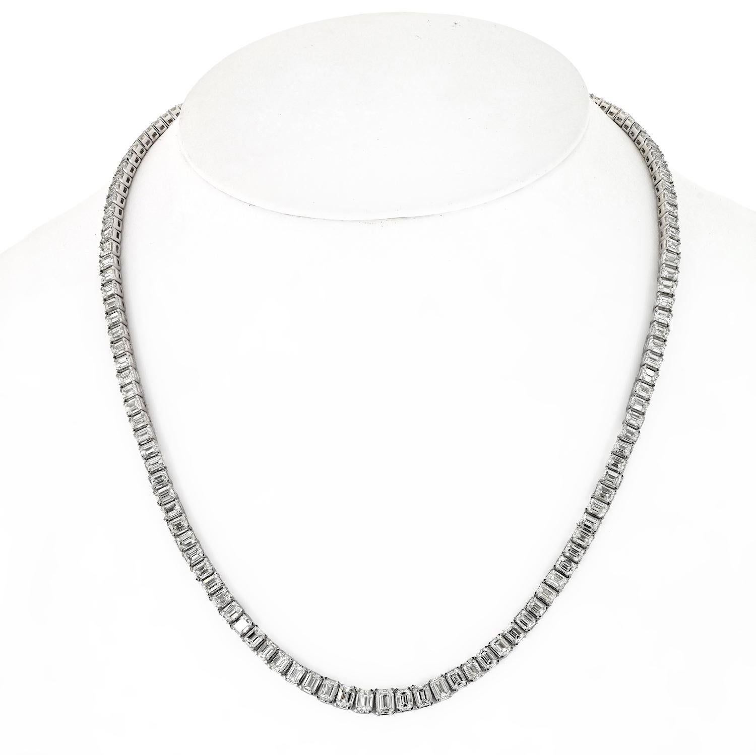 Elevate your elegance with our 18K White Gold 26.00cttw Emerald Cut Diamond Tennis Necklace, a true masterpiece of refined luxury. This exquisite piece boasts a captivating arrangement of 136 graduated emerald-cut diamonds, meticulously set to