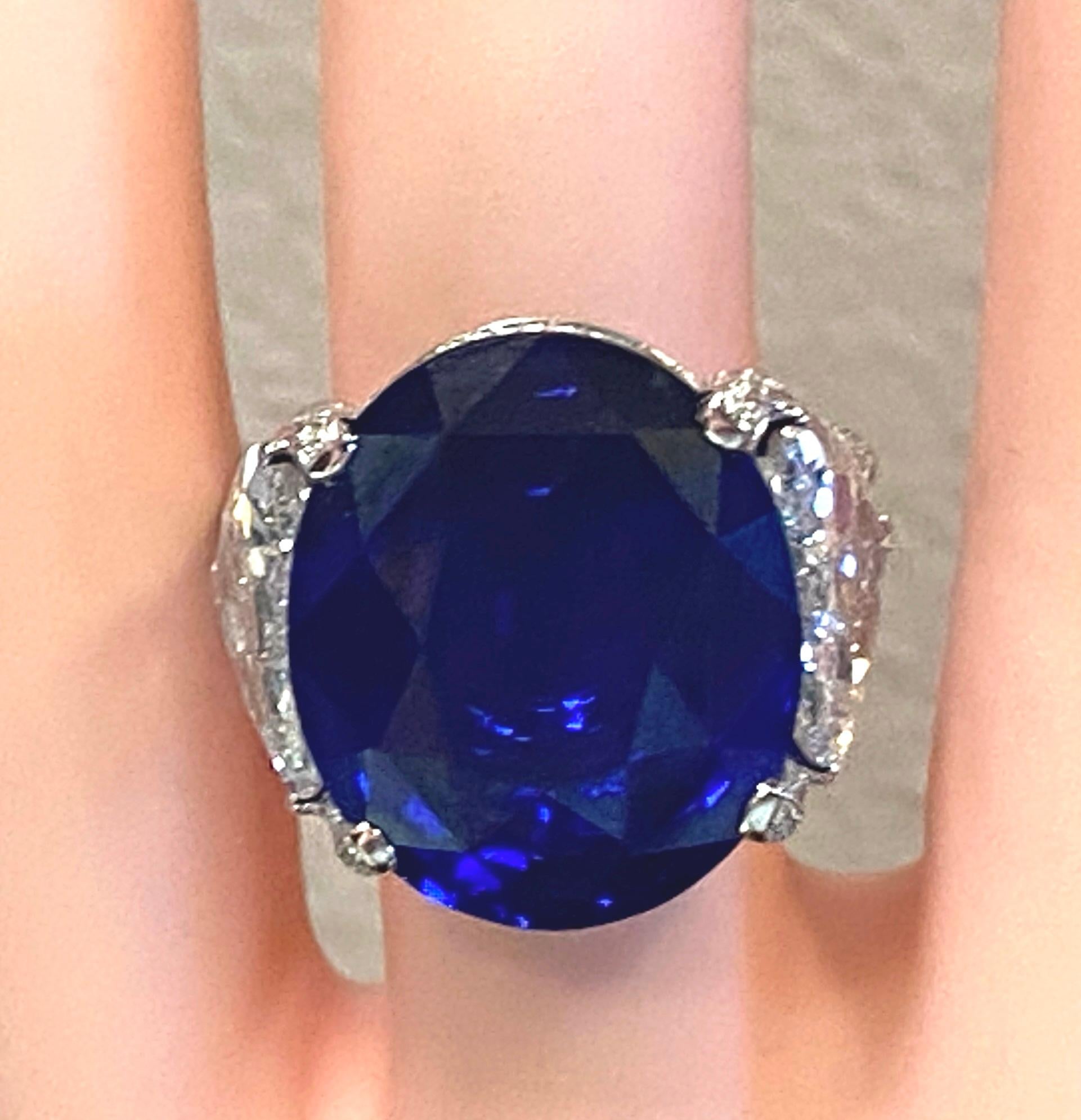 26.08 Carat Oval Shaped Blue Sapphire with 2 GIA Side Trillion Diamonds For Sale 1