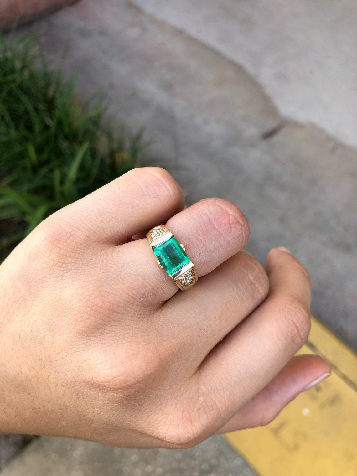 east west emerald cut bezel ring