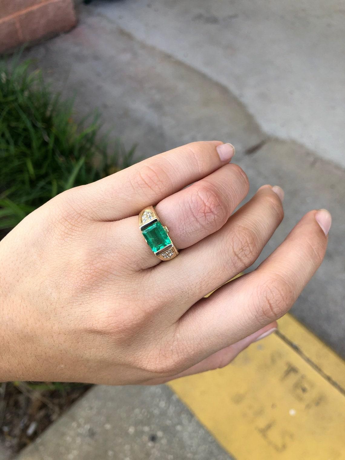 east west bezel emerald ring