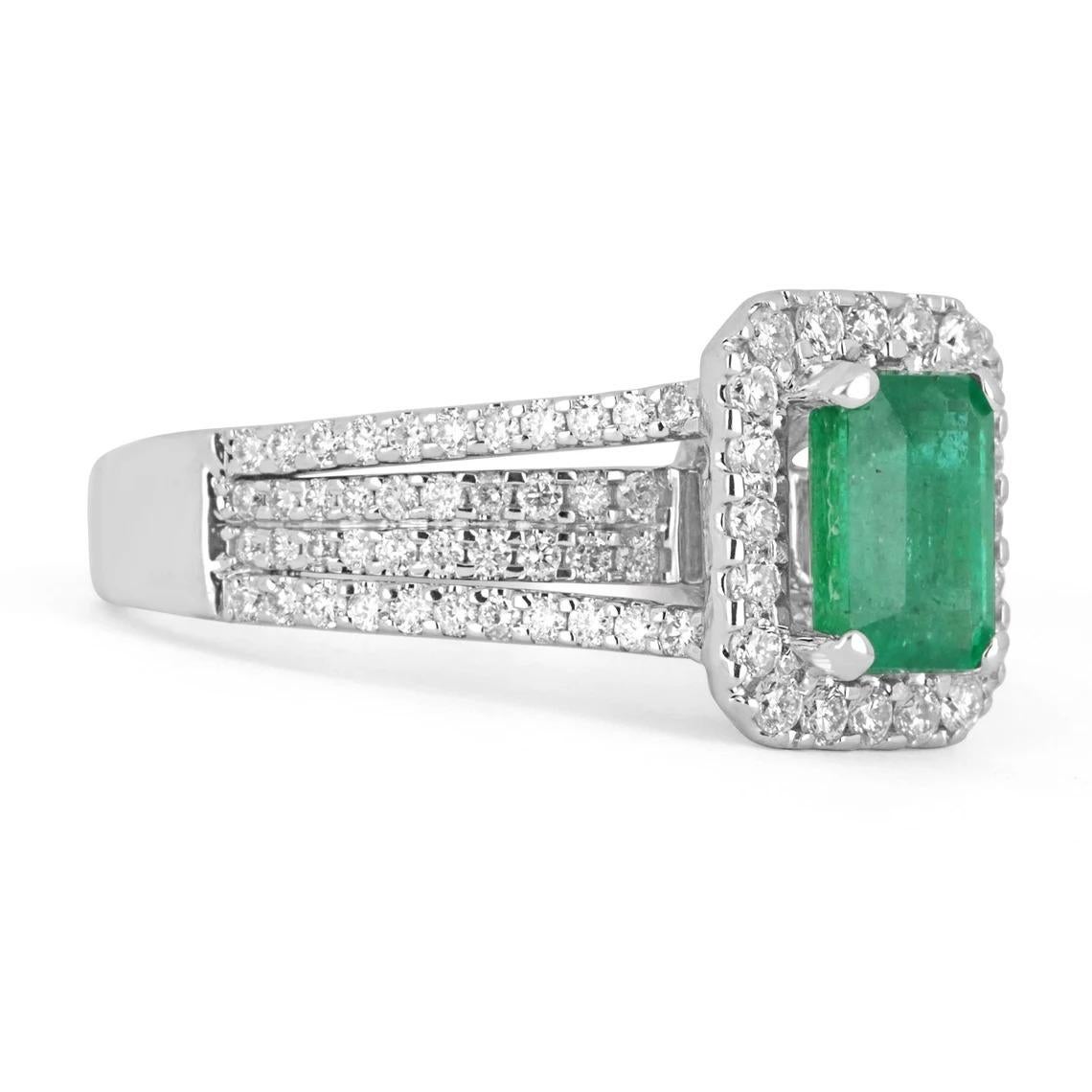 An exquisite emerald and diamond engagement/right-hand ring. The gorgeous setting lets sit a fine quality, earth-mined, natural emerald with beautiful vivid green color and good eye clarity. Brilliant round diamonds are pave set in the halo, and