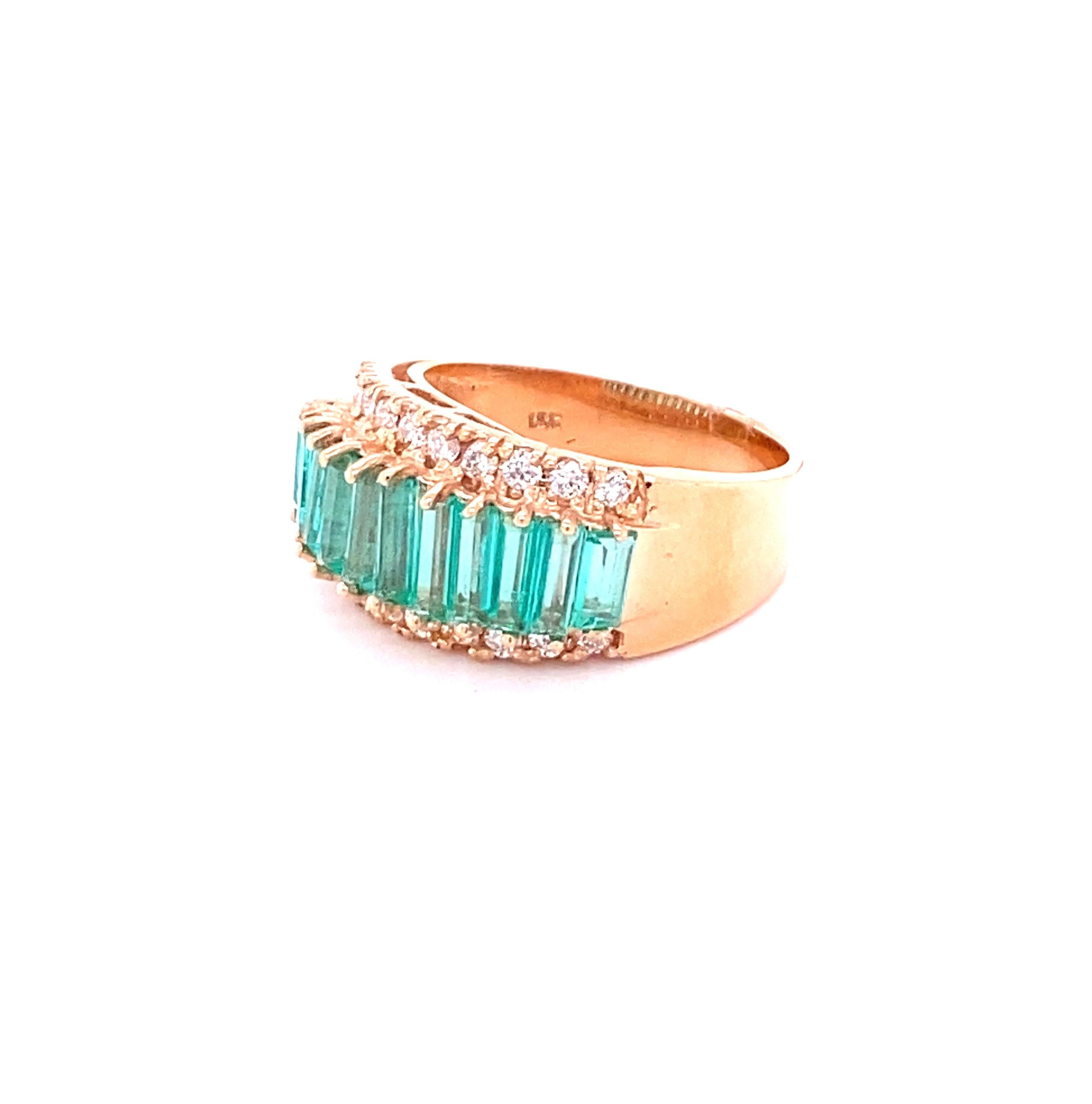 This ring has 11 Natural Baguette Cut Emeralds that weigh 2.12 carats as well as 22 Round Cut Diamonds that weigh 0.49 carats. (Clarity: VS, Color: H) 
The total carat weight of the ring is 2.61 carats.  

The ring is curated in 18 Karat Rose Gold