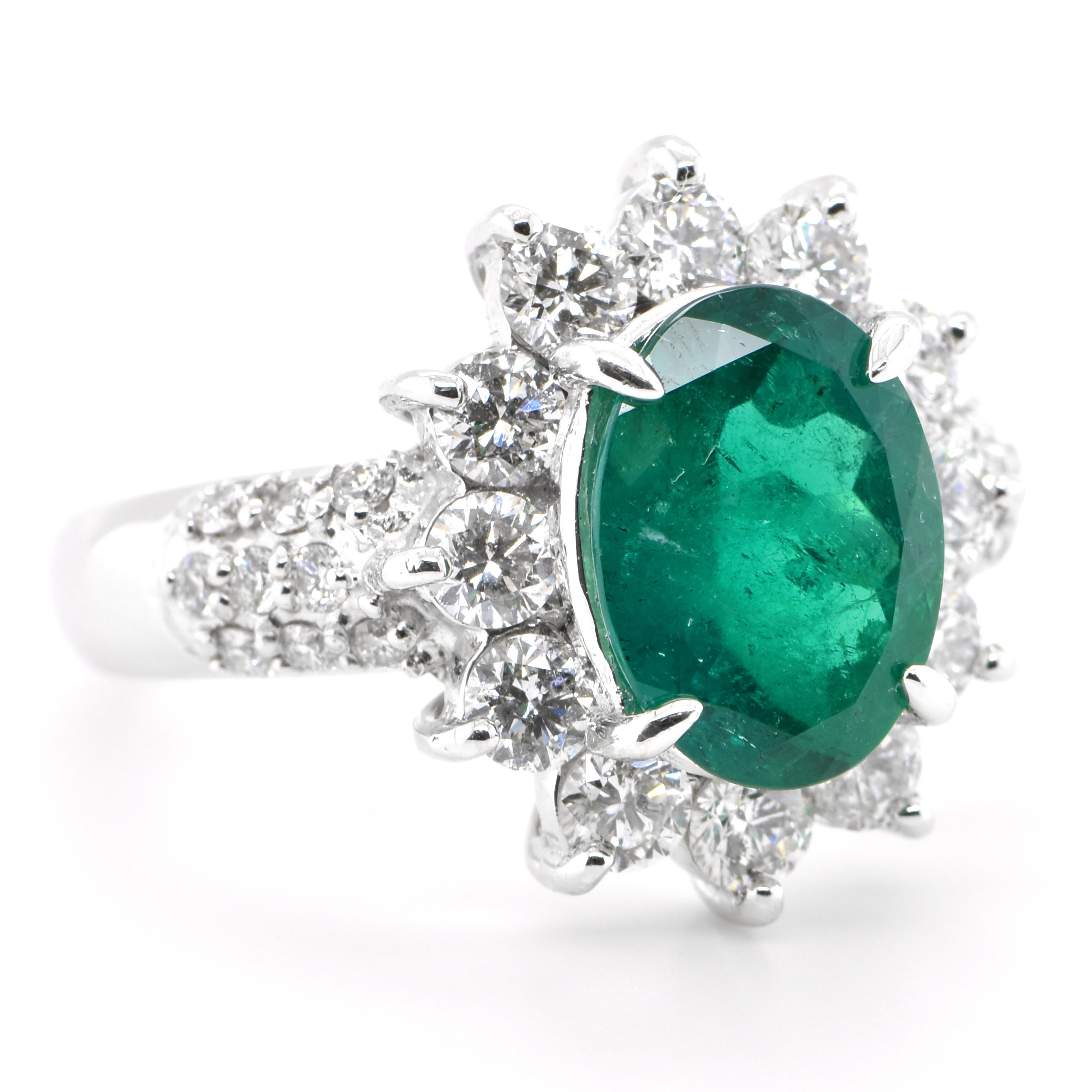 Modern 2.61 Carat Natural Oval-Cut Emerald and Diamond Halo Ring Set in Platinum For Sale