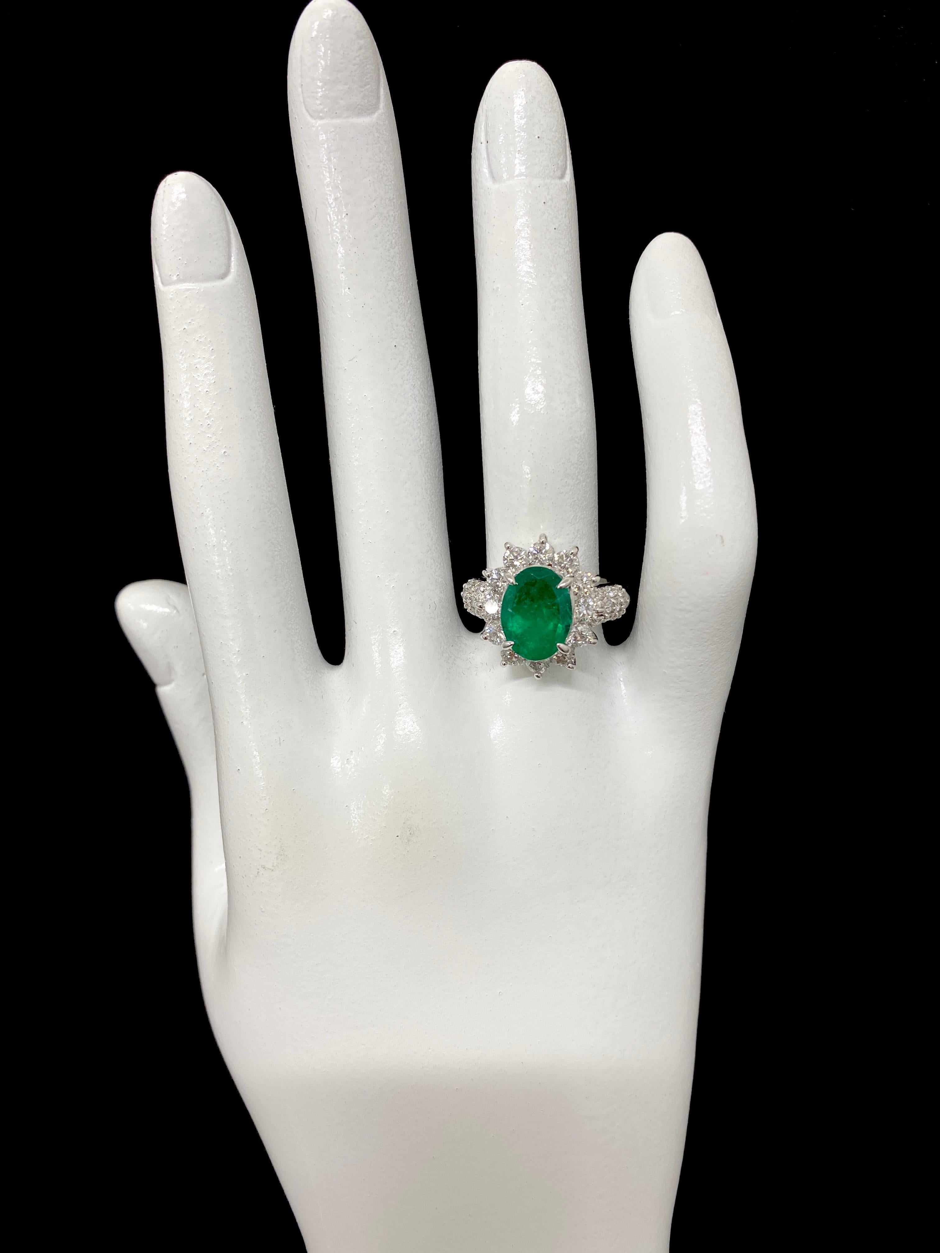2.61 Carat Natural Oval-Cut Emerald and Diamond Halo Ring Set in Platinum For Sale 1