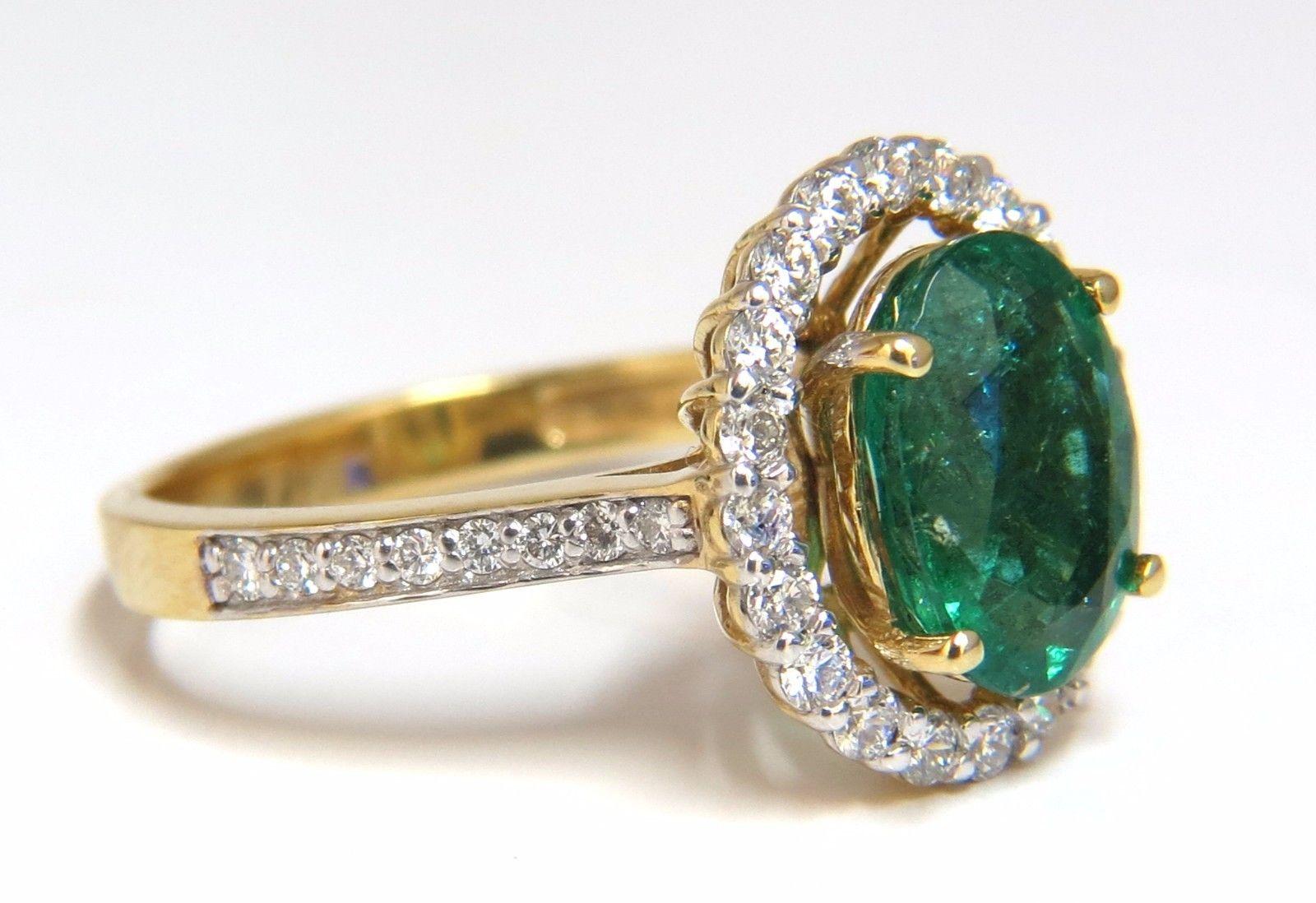 Venetian Mod Deco Green.

1.95ct. Natural Emerald Ring

9.8 X 6.9mm

Transparent & Vivid Green 

.66ct. Diamonds.

Round & full cuts 

G-color Vs-2 clarity.  

14kt. yellow gold

3.4 grams

Ring Current size: 7

Depth of ring: .3 inch

Deck of ring: