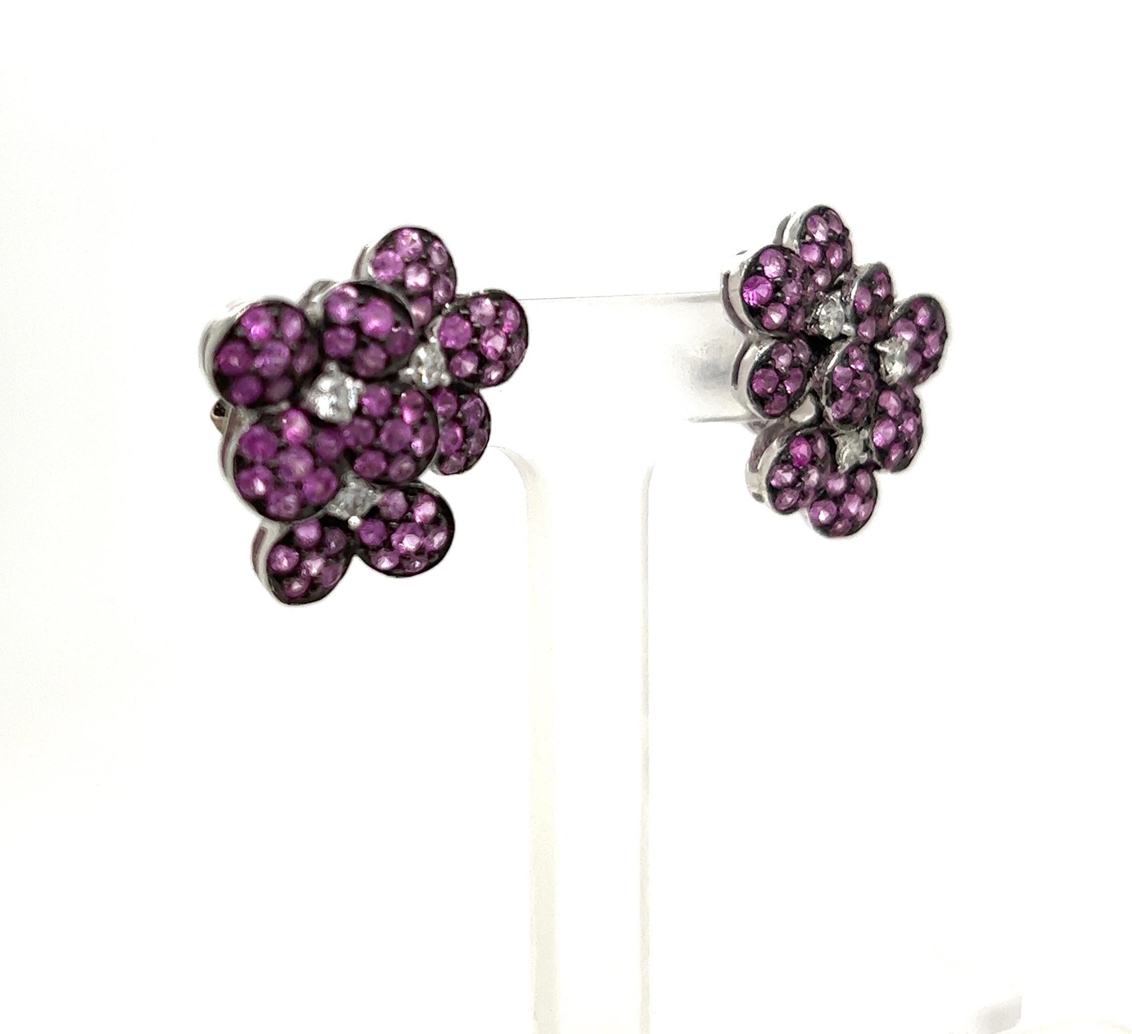 Love the passionate pink color of these flower earrings. With 2.61cts of pink sapphires and .29cts of white diamonds, G color, VS2 clarity, they are a magical addition to your collection.