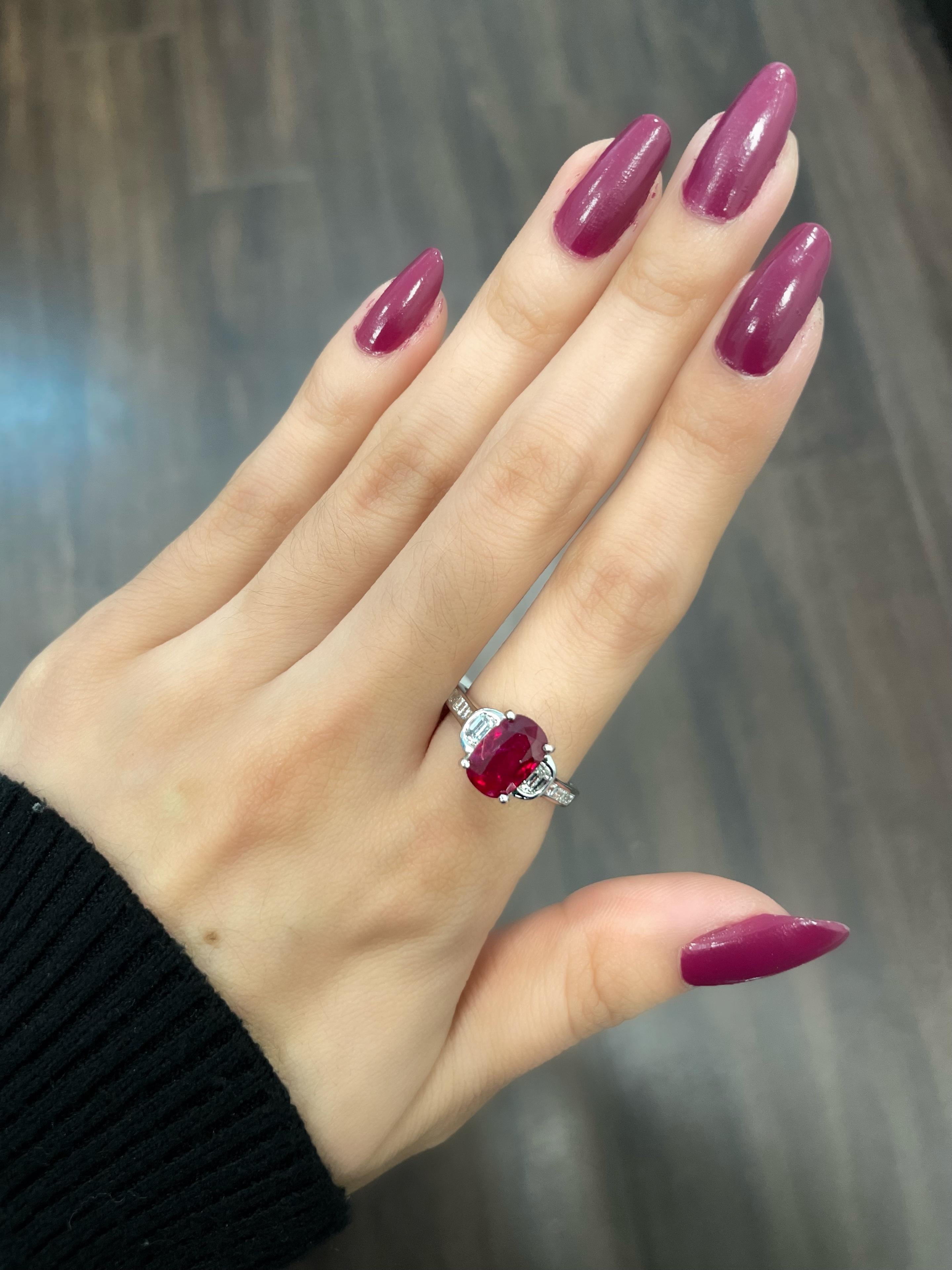 This natural ruby ring is an exceptional piece of jewelry with a 2.61 carat center stone. The ruby's deep red hue is simply mesmerizing, and its clarity is truly remarkable. The stone is set in a classic design, which is both elegant and timeless.