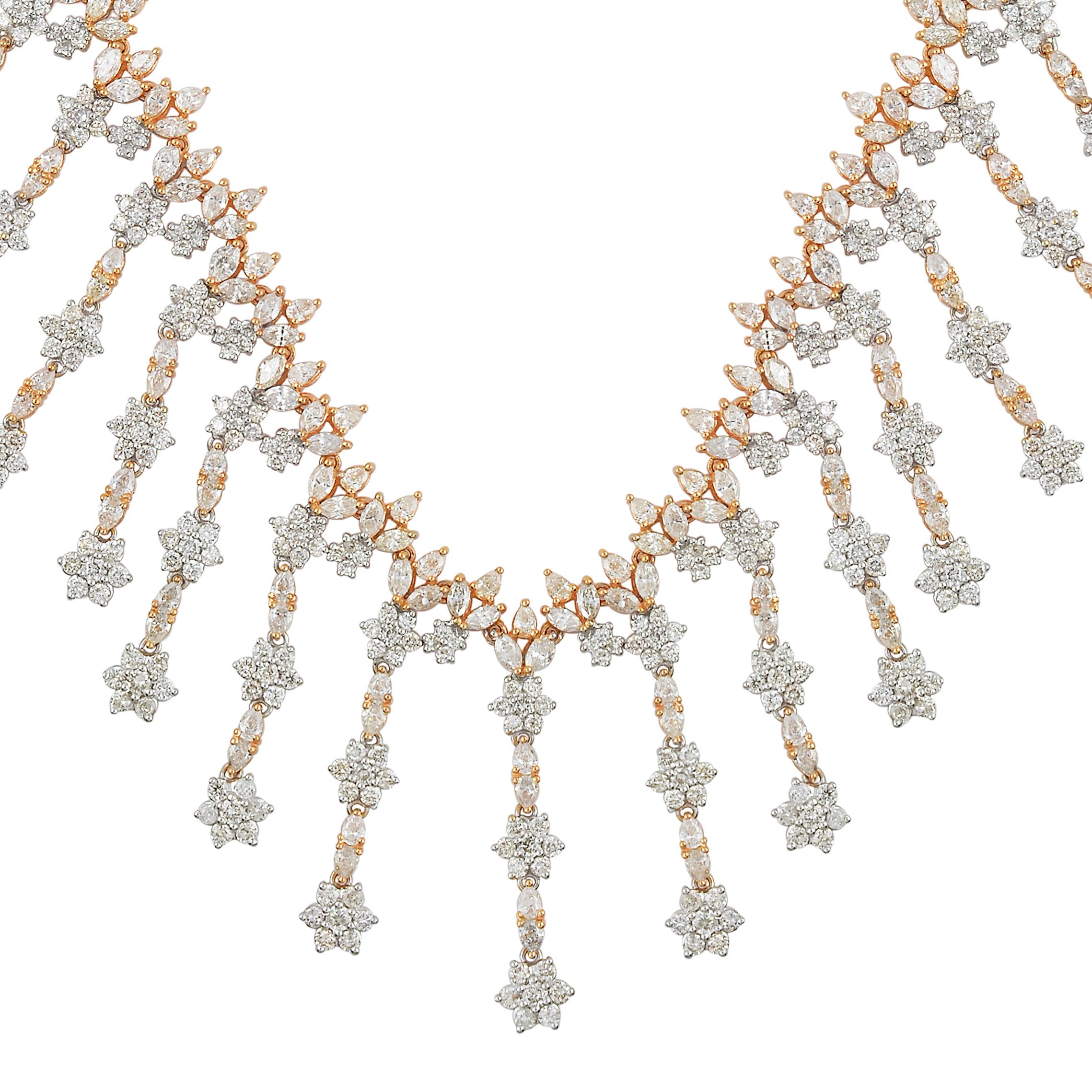 This necklace is a true statement piece, exuding opulence and refinement. Its delicate chain, also crafted in 14 karat white and yellow gold, complements the charm perfectly, creating a seamless and elegant look. The chain is adjustable, allowing