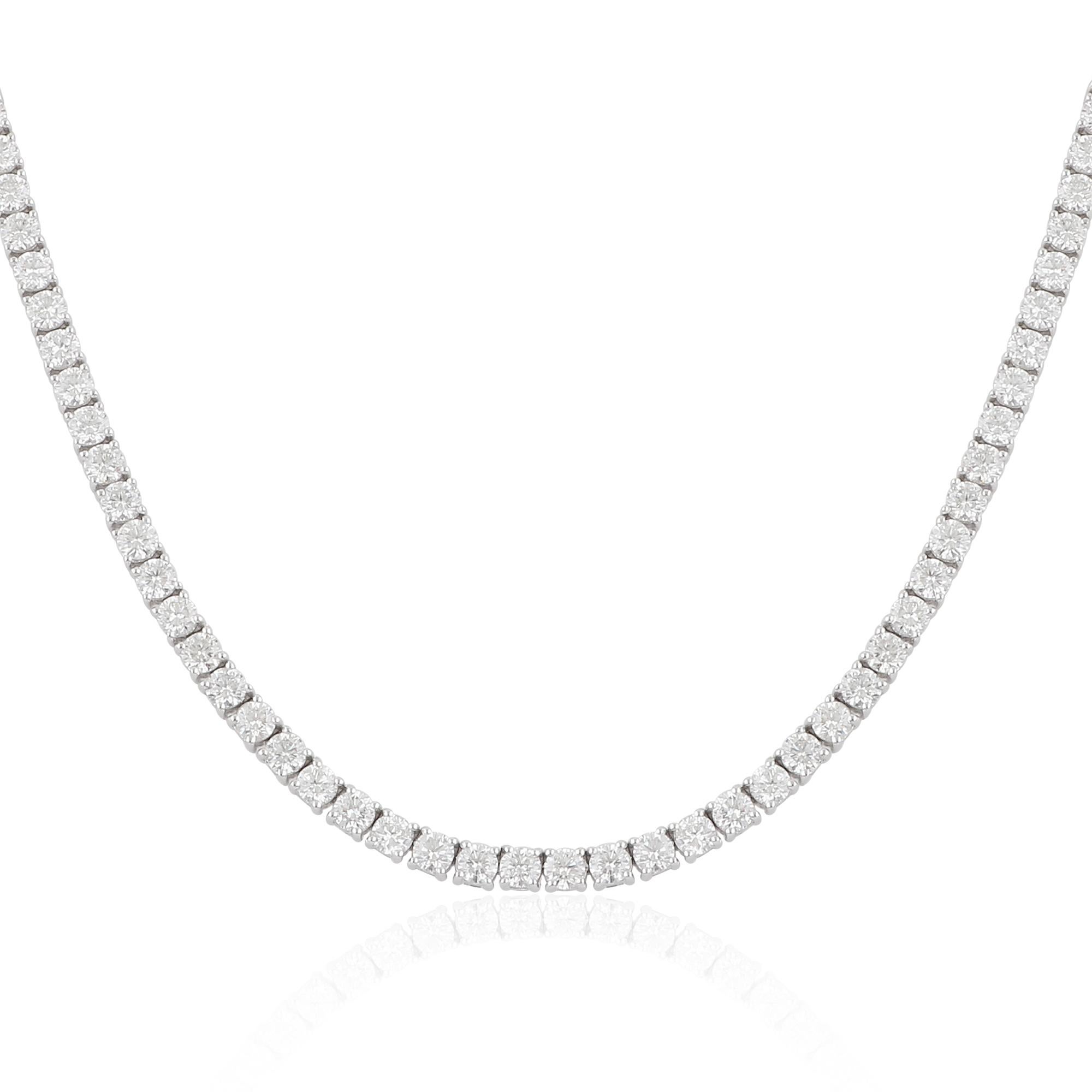 A tennis chain necklace featuring a 26.10 carat diamond in 14 karat white gold is an extraordinary and opulent piece of handmade jewelry. The necklace typically showcases a continuous line of round or square-cut diamonds set in a white gold