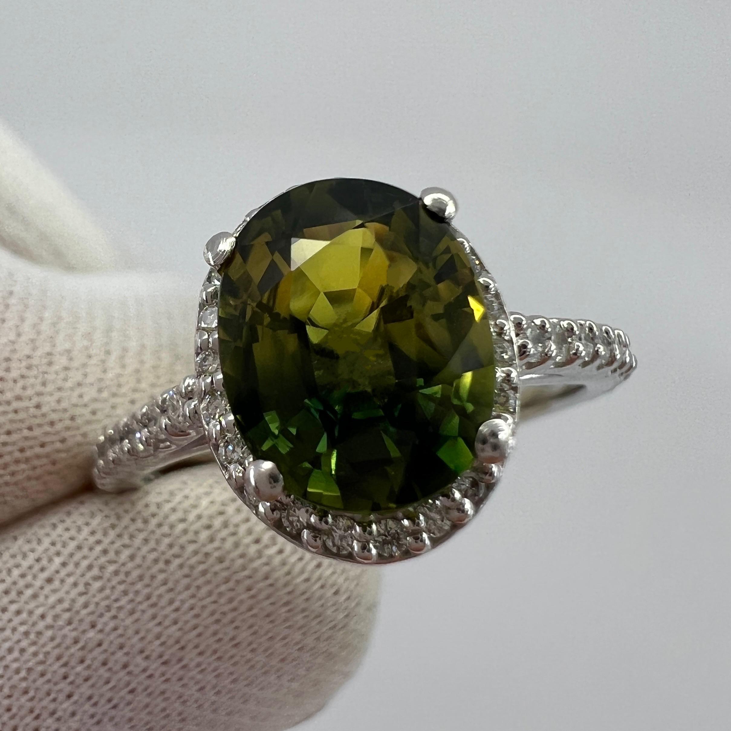 Bi Colour Green Yellow Australian Sapphire & Diamond Platinum Halo Ring.

Unique 2.31 carat Australian sapphire with a stunning yellow green bi colour effect. Rare and unique stone. 

Also has excellent clarity, very clean stone with only some small