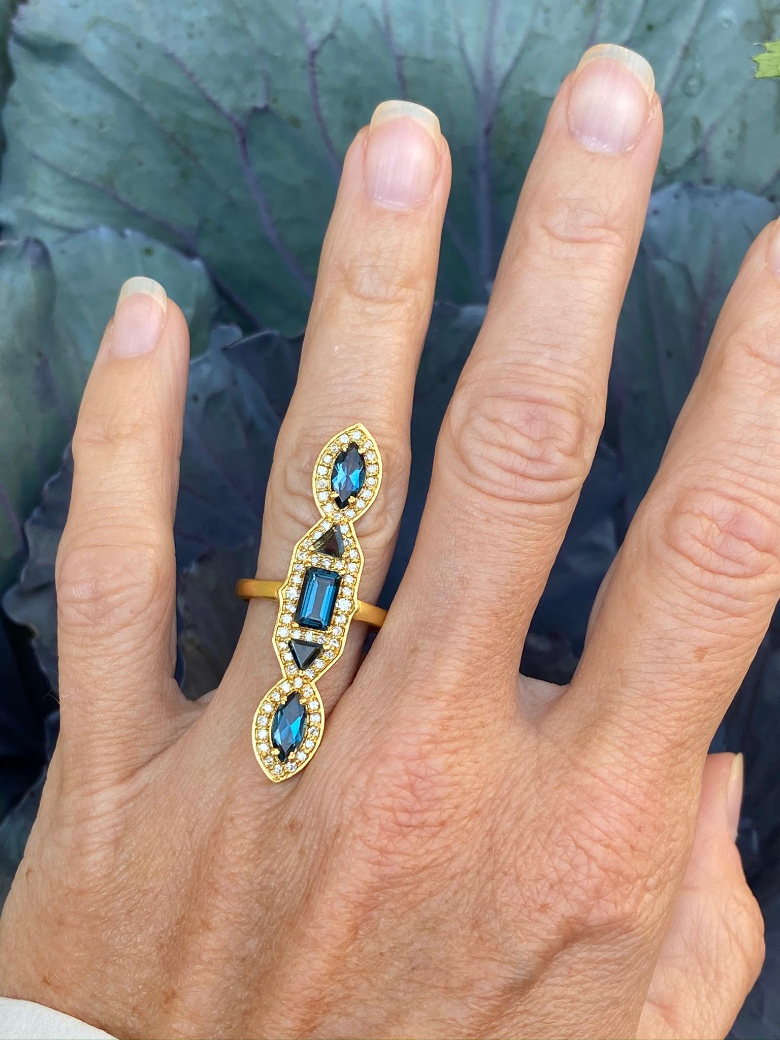 Designed by award winning jewelry designer, Lauren Harper, this 2.62 carat London Blue Topaz and .45 carat Diamond statement ring is made in 18kt Gold. Size 6.5. Can be made in any size as a special order. Also can be made in Pink Tourmaline as