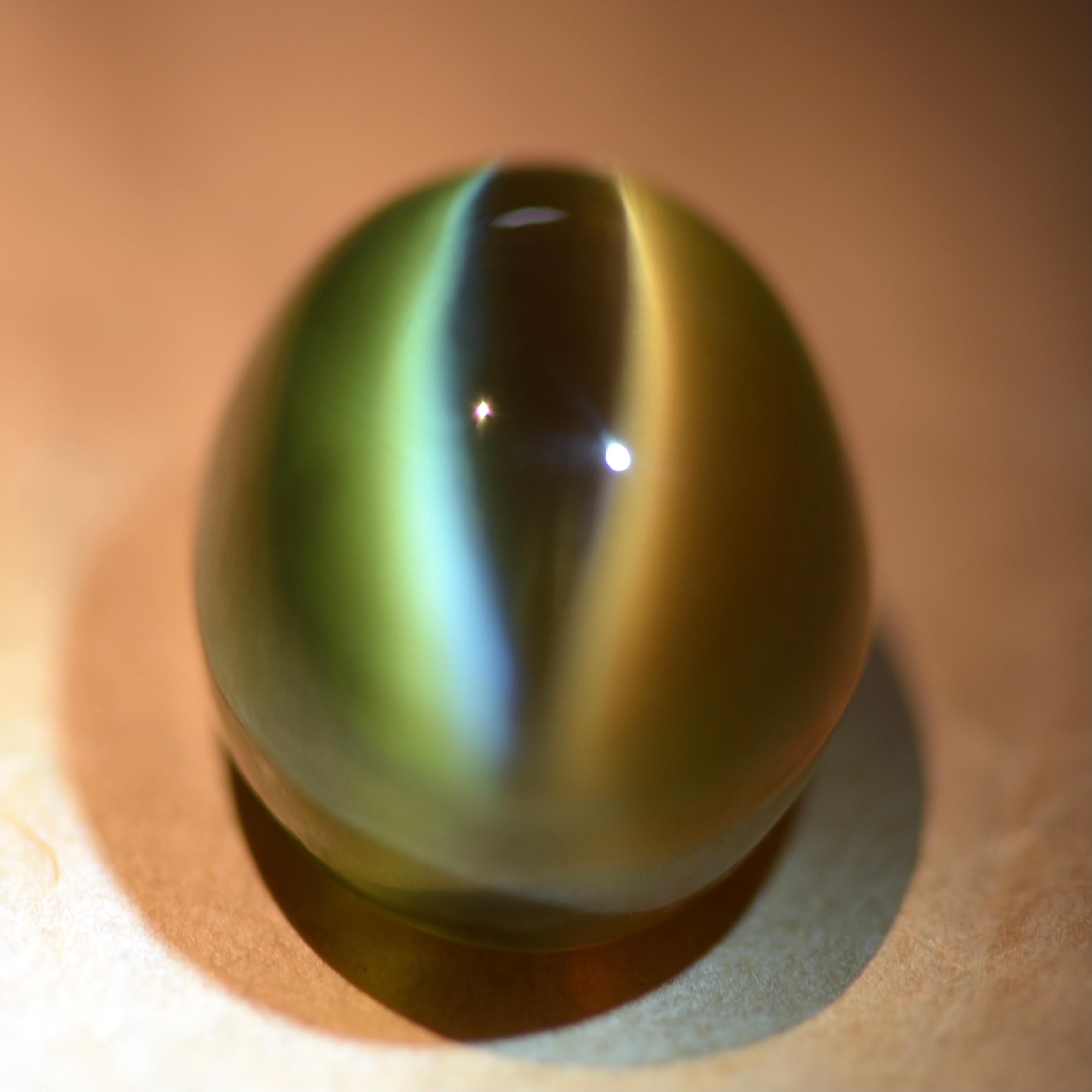 Only a small number of gemstones have phenomenal like the ability to show a sharp line that moves along with the light beneath the surface of the stone. This effect is called cat's eye effect. 
And chrysoberyl is the best known gem material that