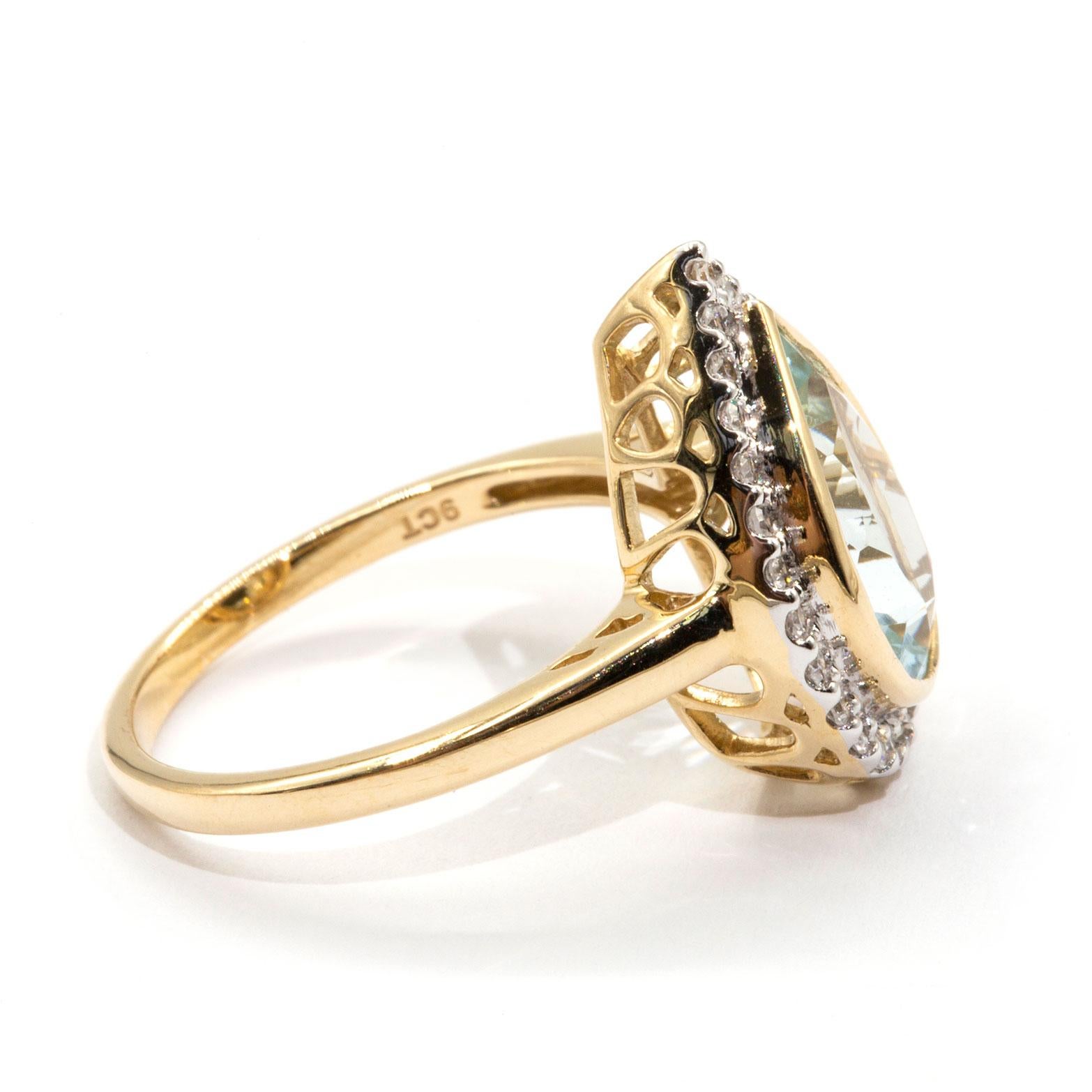 Contemporary 2.62 Carat Pear Cut Aquamarine and Diamond Halo Cluster 9 Carat Yellow Gold Ring