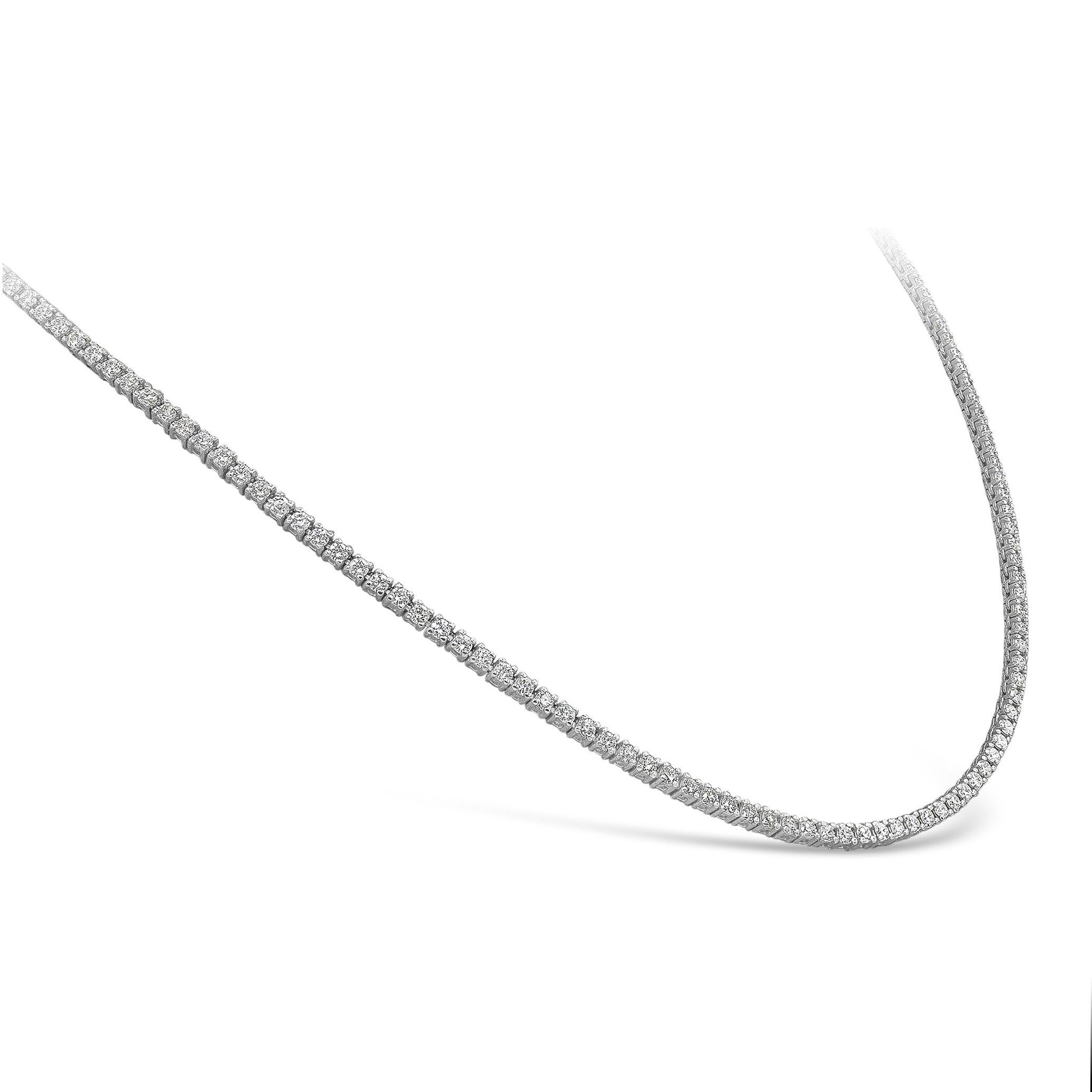 A simple tennis necklace showcasing a row of round brilliant diamonds weighing 2.62 carats total, set in a polished 14k white gold mounting. 

Style available in different price ranges. Prices are based on your selection. Please contact us for more