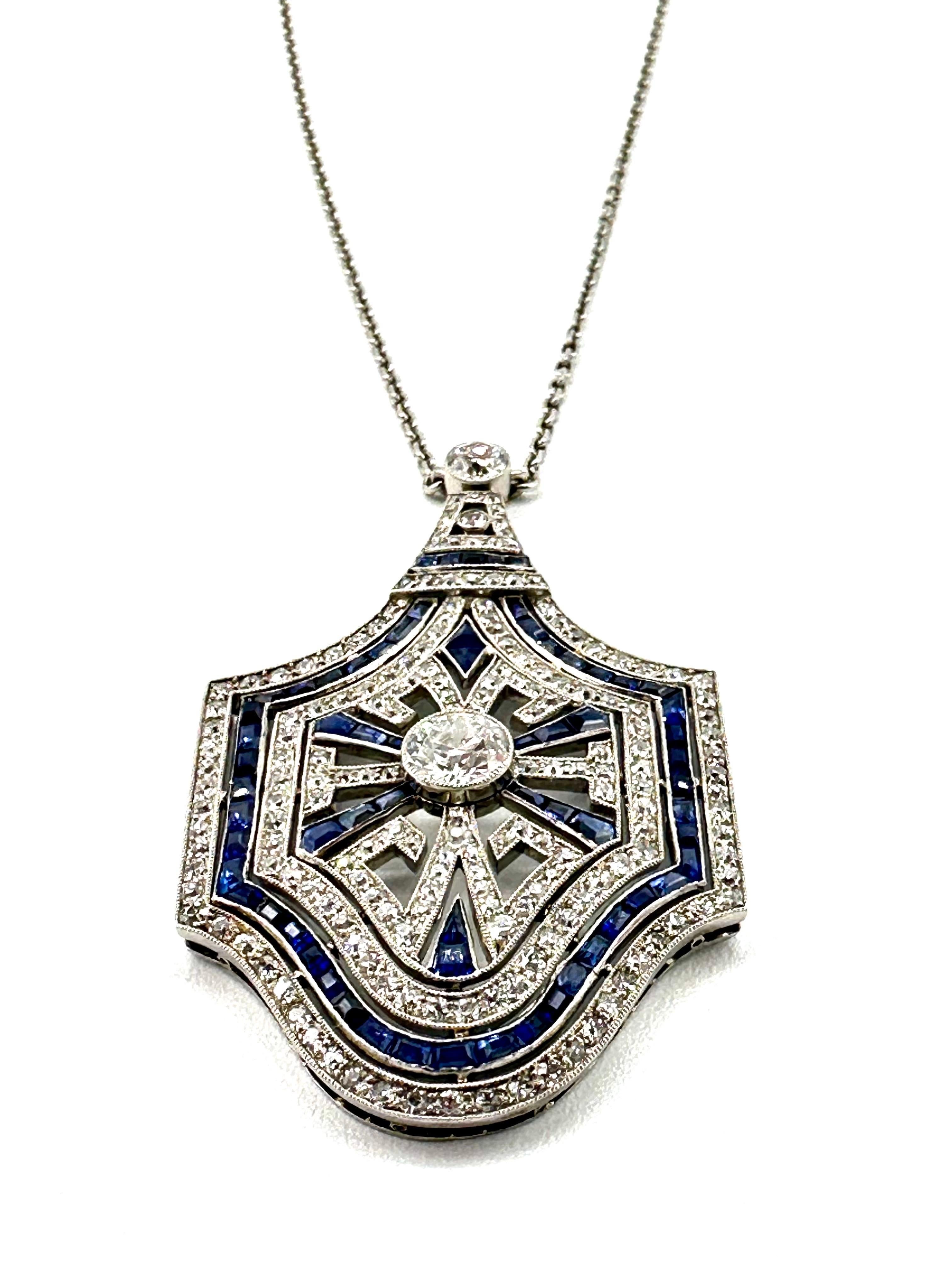An amazing piece of craftsmanship!  This Art Deco pendant necklace is a definite eye catcher.  Handcrafted in all platinum, the pendant contains 183 round cut Diamonds with a total weight of 2.62 carats, set with rectangular cut sapphires that have
