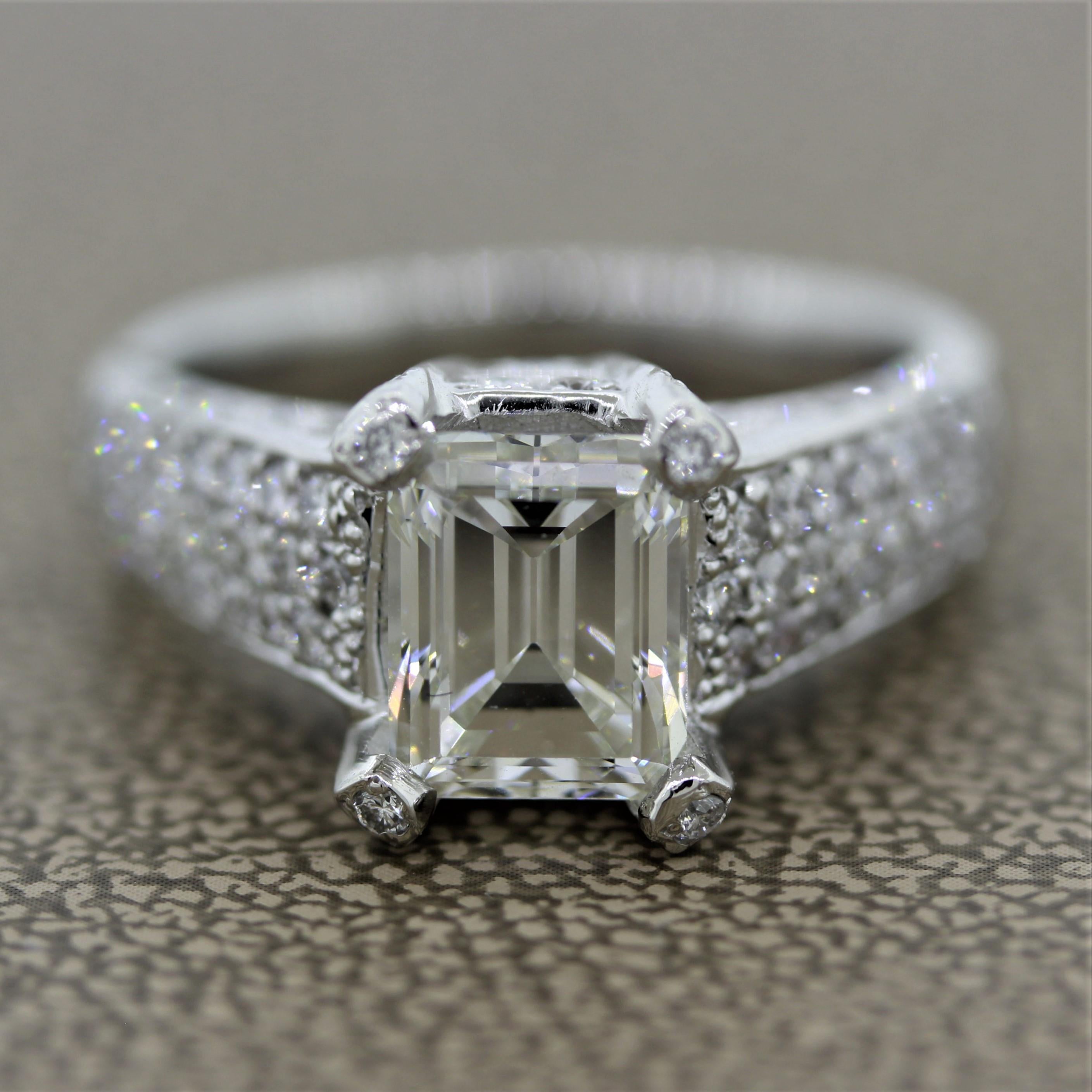 A lovely diamond engagement ring featuring a 2.62 carat emerald cut diamond certified by the GIA with I color and VS2 clarity. The ring is accented by 1.11 carats of round brilliant cut diamonds which are set around the settings and sides of the