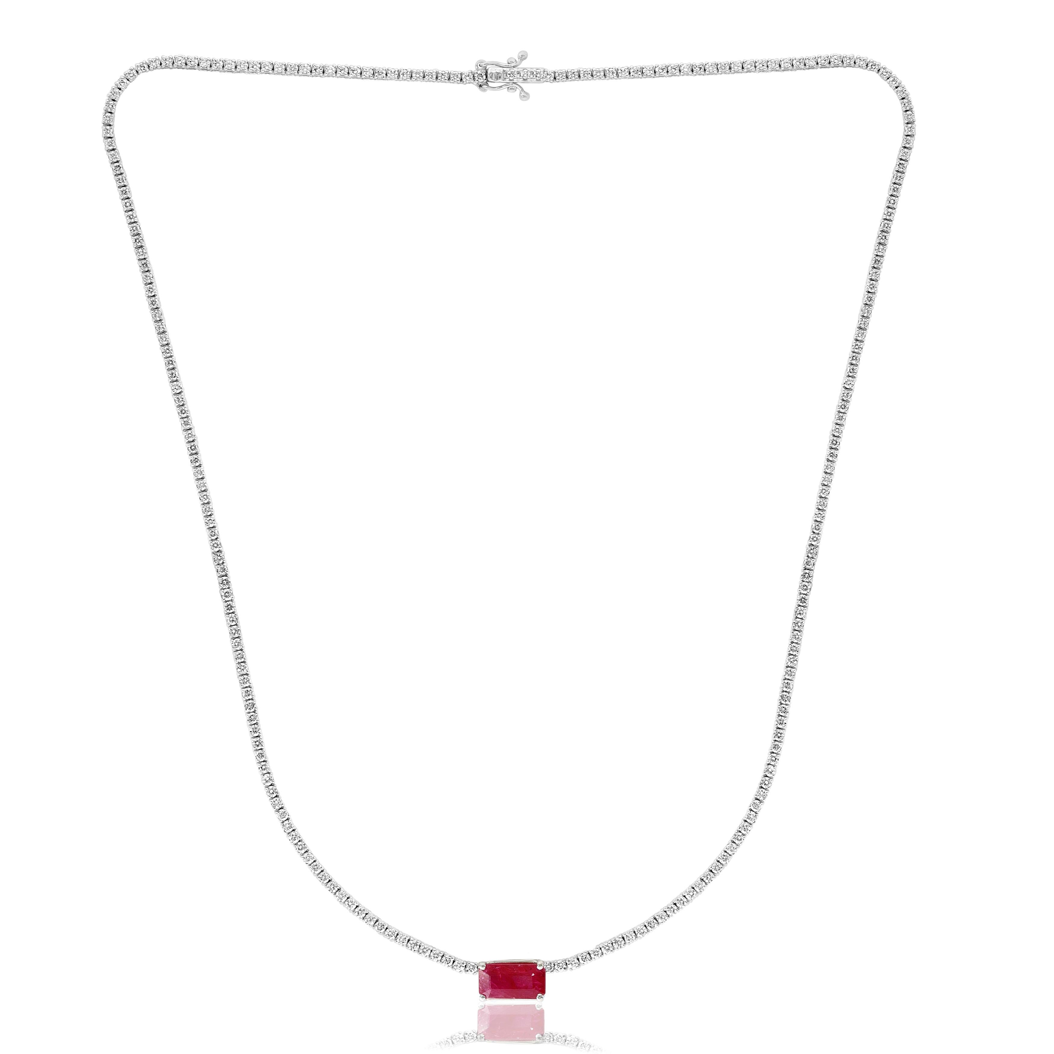 A brilliant and classic piece showcasing emerald cut red ruby in the center weighing 2.63 carats and a line of round diamonds on both sides set in 14K White Gold. 239 diamonds in this necklace are brilliant round cut and weigh 3.01 carats in total.