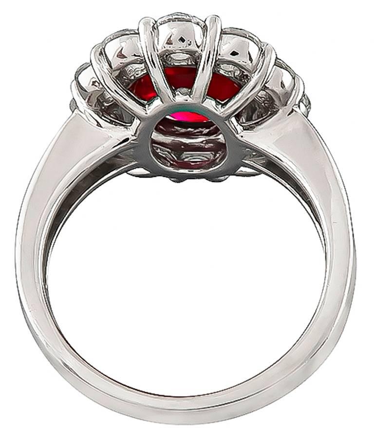 This elegant platinum ring is centered with a lovely GIA certified natural no heat cushion cut Mozambique ruby that weighs 2.63ct. Accentuating the ruby are high quality sparkling baguette and round cut diamonds that weigh 1.94ct. graded H color