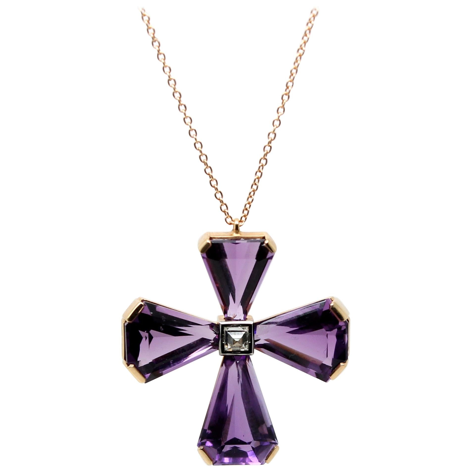 Elegant and Modern Amethyst Cross Pendant Necklace, Hand-Made in Italy, composed by 4 Purple Triangular Amethysts for 26.30 Carat total, with 1 Square Diamond in the centre of 0.36 Carat. The Center White Diamond is set upsidedown to better catch