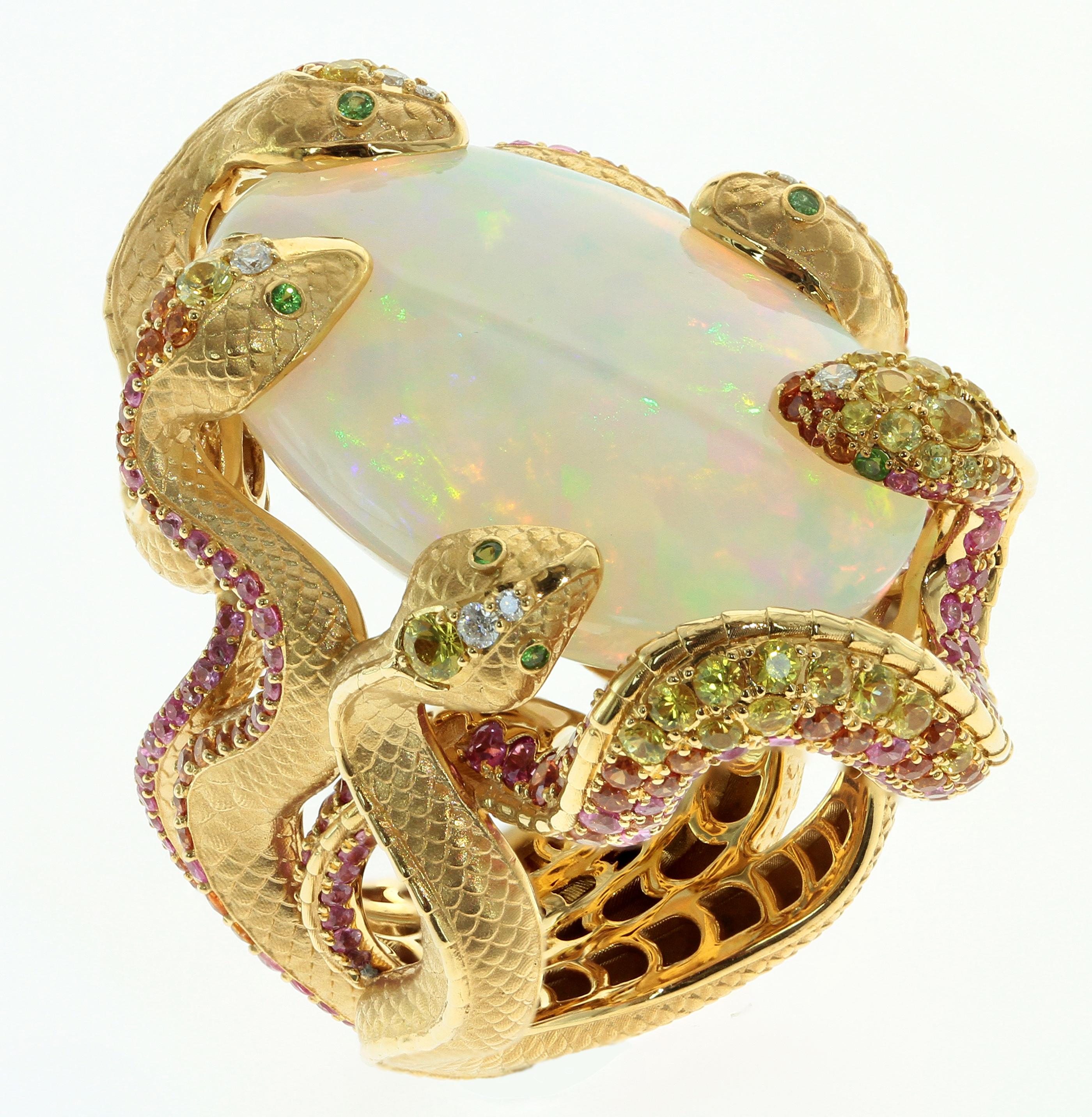 26.33 Carat Opal surrounded by Diamonds, Pink and Yellow Sapphire. Five gorgeous Snake guard the opal in this Ring

27x39x34.6 mm
32.95 gm

US Size 8.0
EU Size 56.5