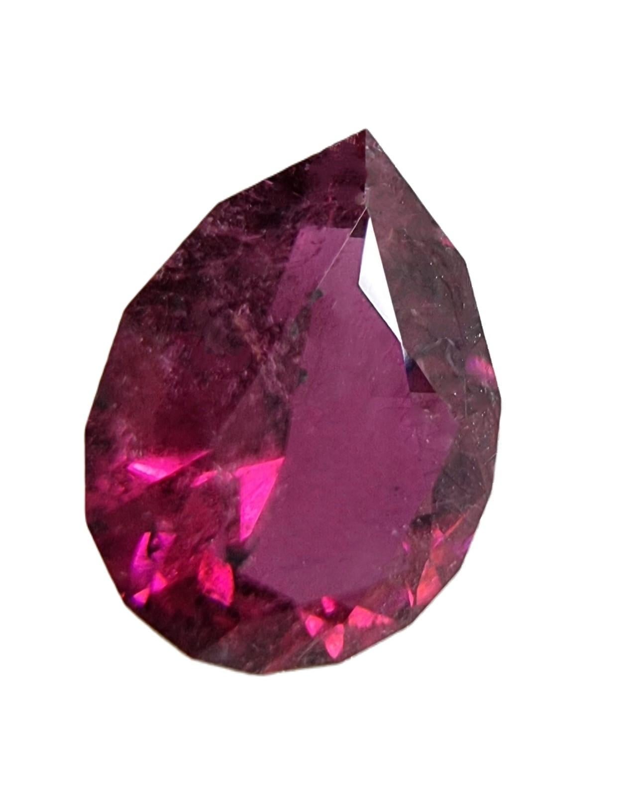 Introducing the exquisite beauty of our 2.63-carat Pear Cut Pinkish Red Rubellite Tourmaline Loose Gemstone. 

Gemstone Details:
Carat Weight: 2.63 carats
Shape: Pear Cut
Variety: Pinkish Red Rubellite Tourmaline
Dimension:  10mm x 7.0mm x