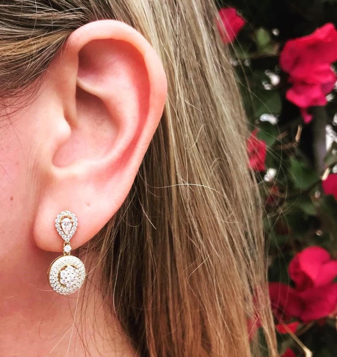 An intricate, eye-catching pair of pave set drop earrings, from our Bridal collection. Featuring 2.64ct of flawless dazzling round brilliant cut cubic zirconia, accented by a halo set pear shape on a push back stud fitting.

Composed of 925 sterling