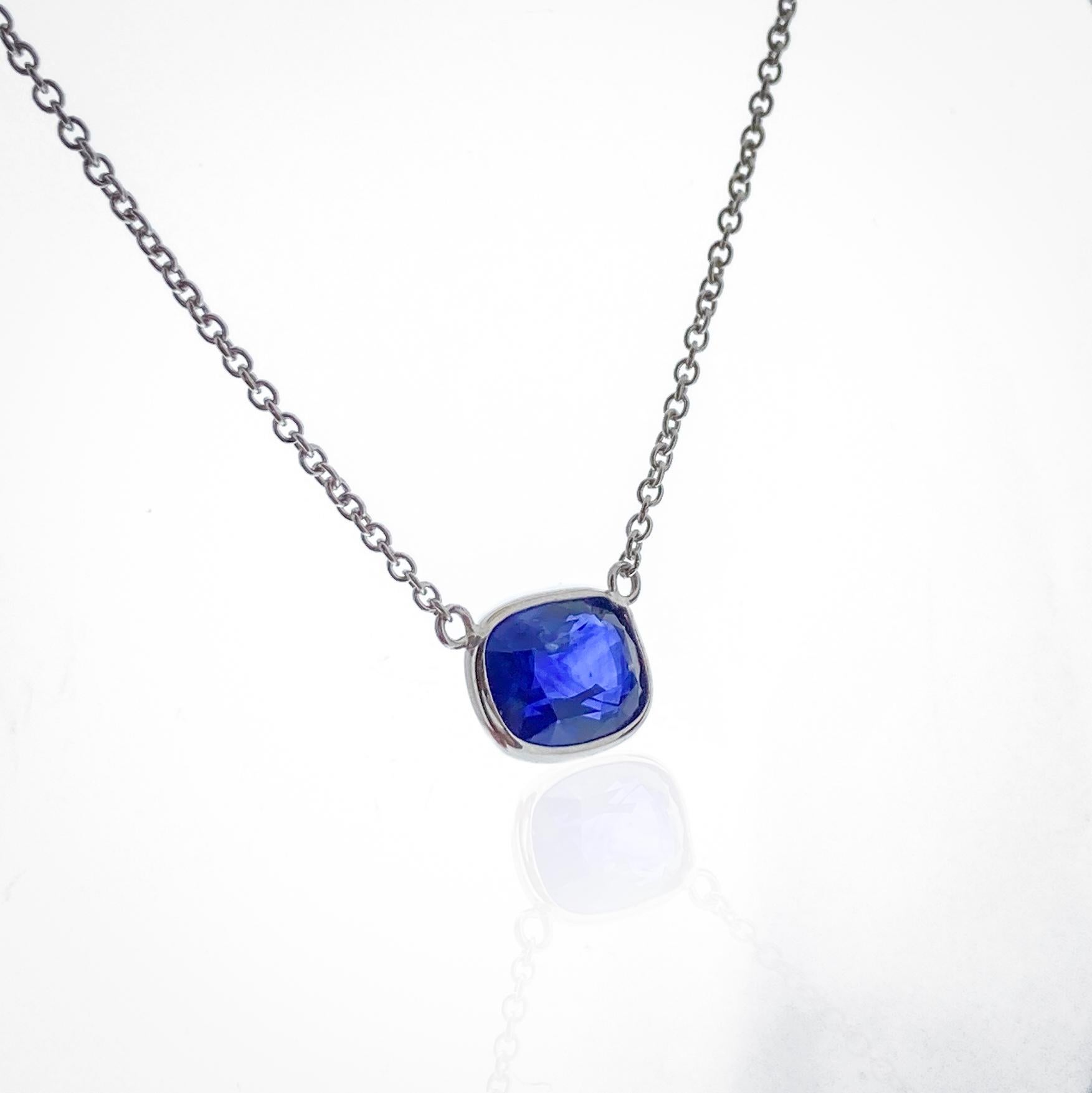 This necklace features a cushion-cut blue sapphire with a weight of 2.64 carats, set in 14k white gold (WG). Blue sapphires are highly sought after for their deep and rich color, making them a classic choice for jewelry. The cushion cut is a popular