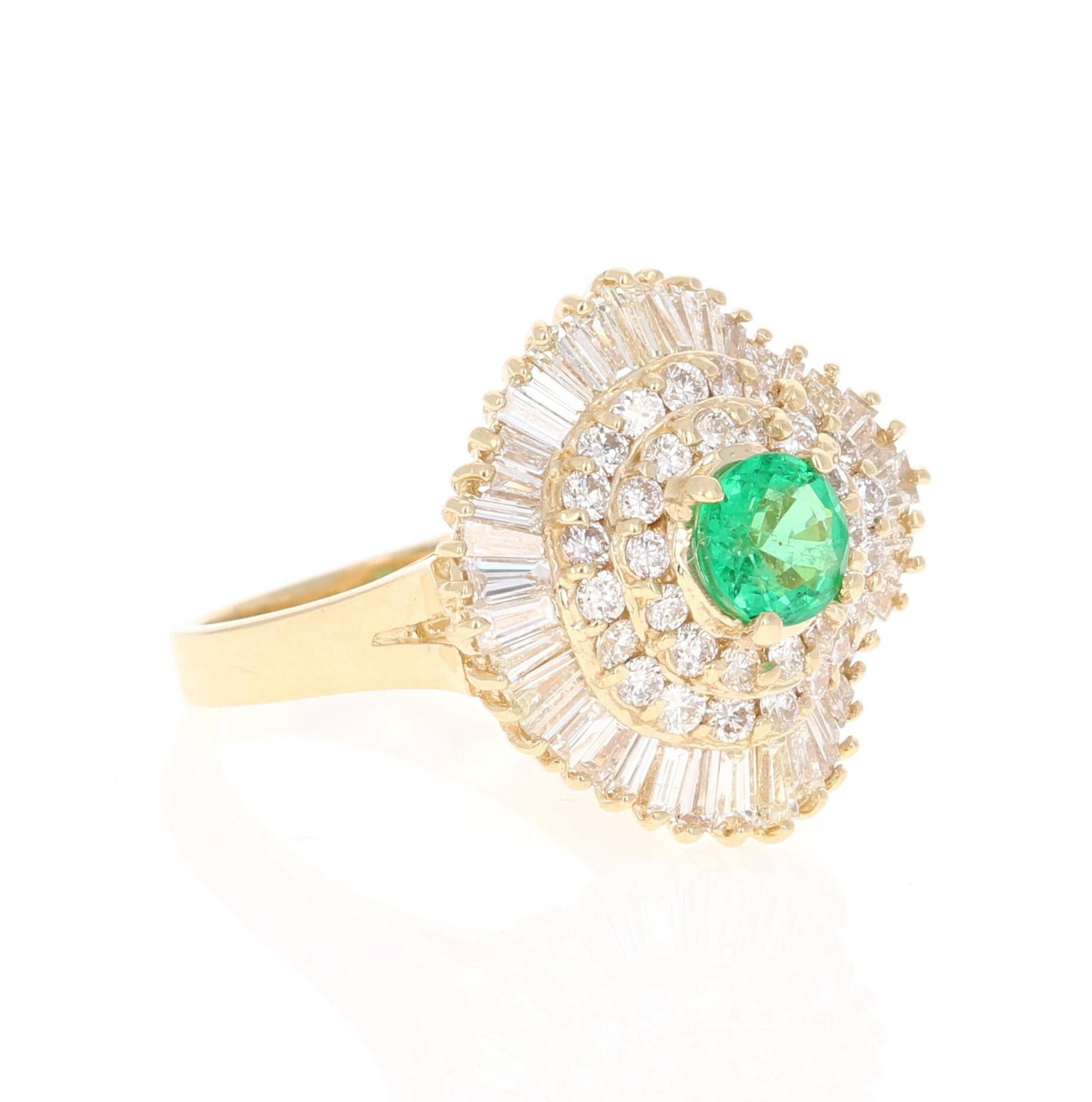 A beautiful 2.64 Carat Emerald and Diamond Ring in 14K Yellow Gold.
This gorgeous ring has a 0.72 Carat Round Cut Emerald that is set in the center of the ring! The Emerald is surrounded by 36 Round Cut Diamonds that weigh 0.72 carats as well as 44