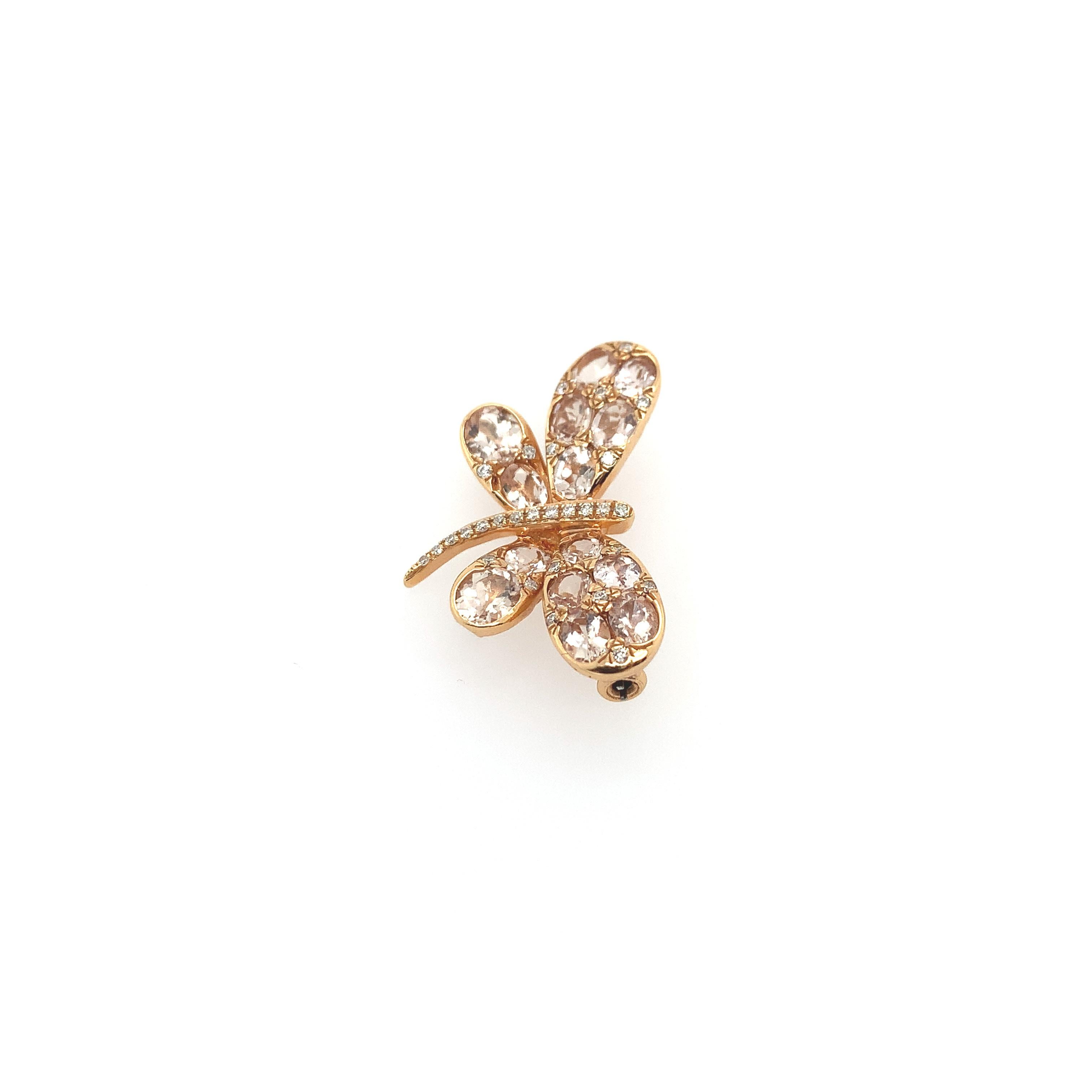 An exquisite dragonfly pin in 18K rose gold embellished with (14) fourteen morganite rose cut stones totaling an estimated 2.64 carats throughout its wings and studded with (29) twenty-nine diamonds totaling .14 carats on its wings and body. The