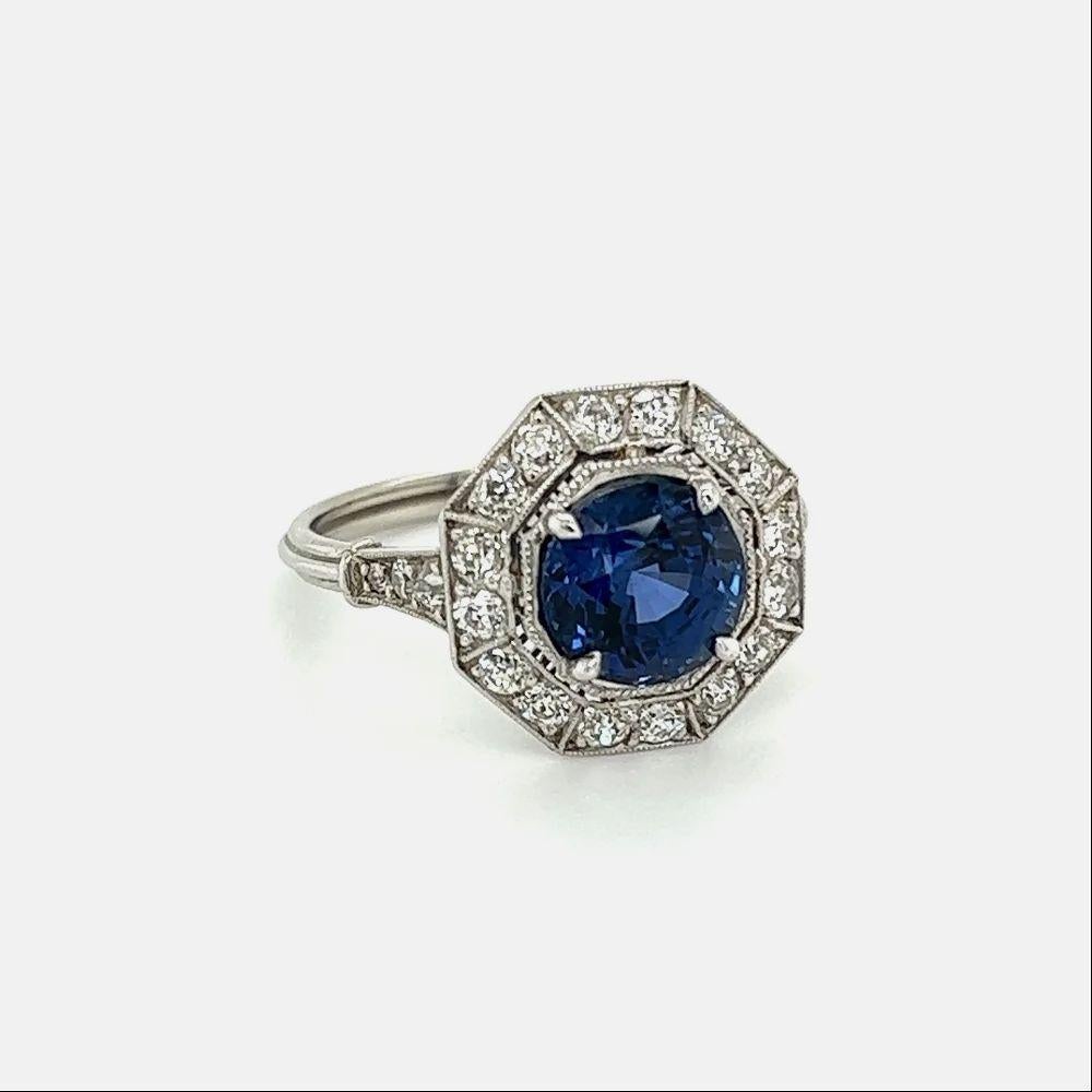 Simply Beautiful! Chic and Classic finely detailed Art Deco Sapphire and Diamond Platinum Cocktail Ring. Centering a securely nestled Hand set 2.64 Carat Fabulous Round Sapphire surrounded by Diamonds, weighing approx. 0.78tcw, including on shank.